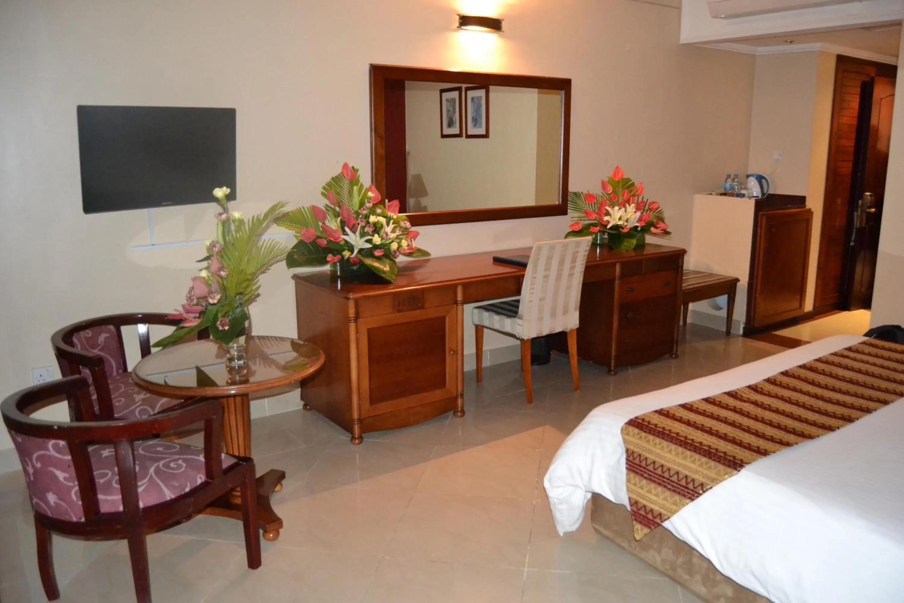 Bedroom, TV/Entertainment Center in Golden Tulip Tanzania