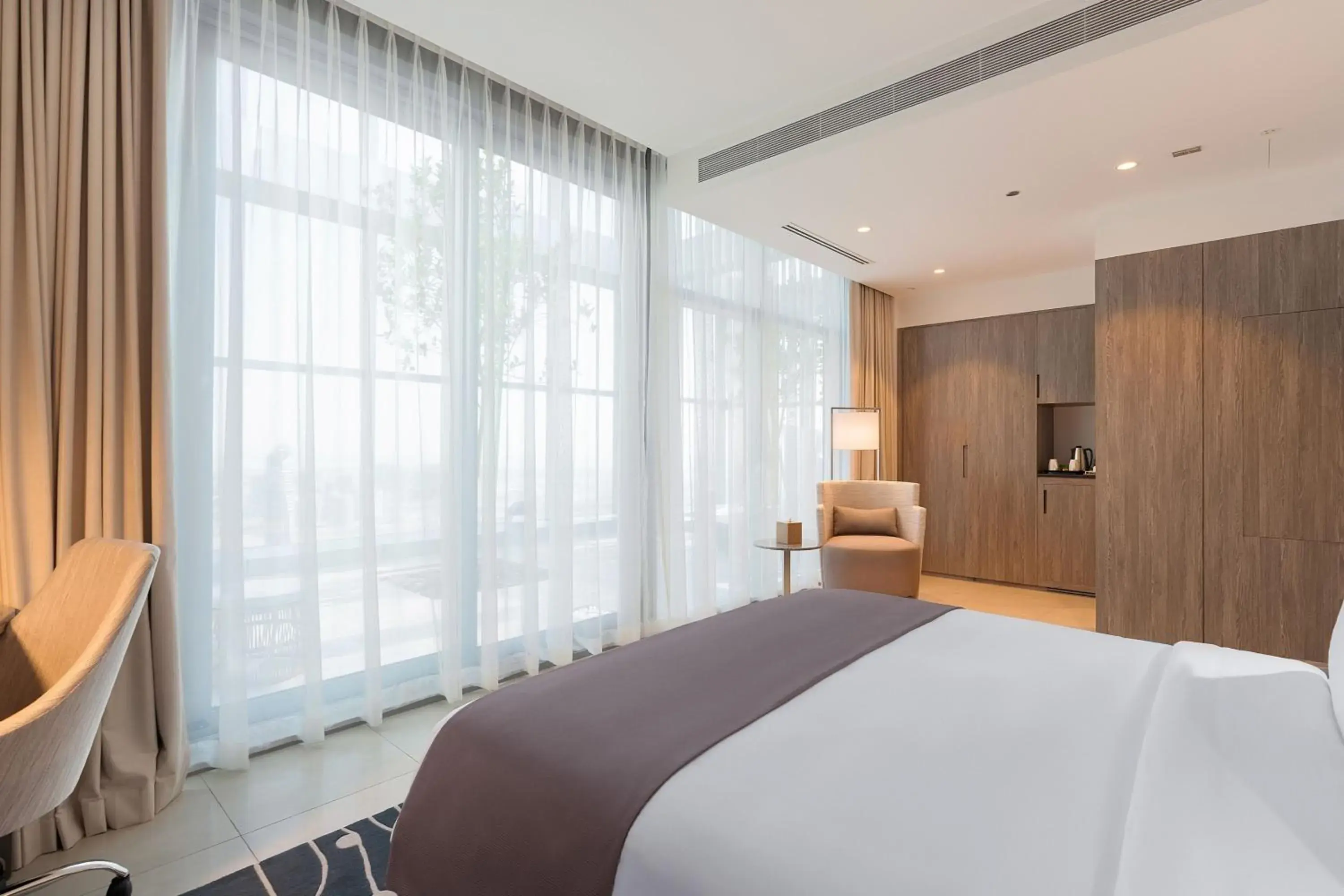 Swimming pool, Bed in The First Collection Dubai Jumeirah Village Circle, a Tribute Portfolio Hotel Swimming pool, Bed in The First Collection Dubai Jumeirah Village Circle, a Tribute Portfolio Hotel