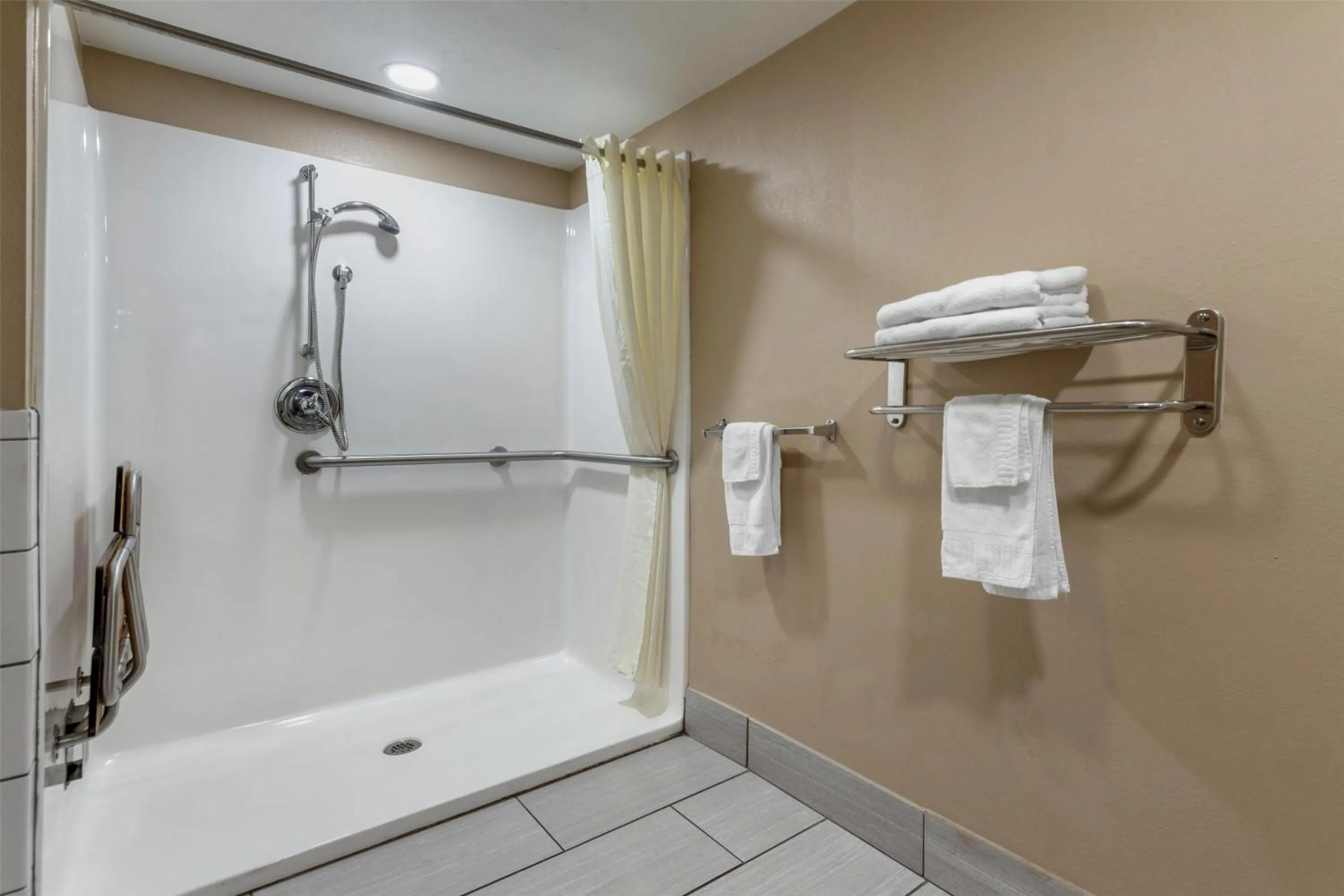 Bathroom in SureStay Plus Hotel by Best Western Poteau