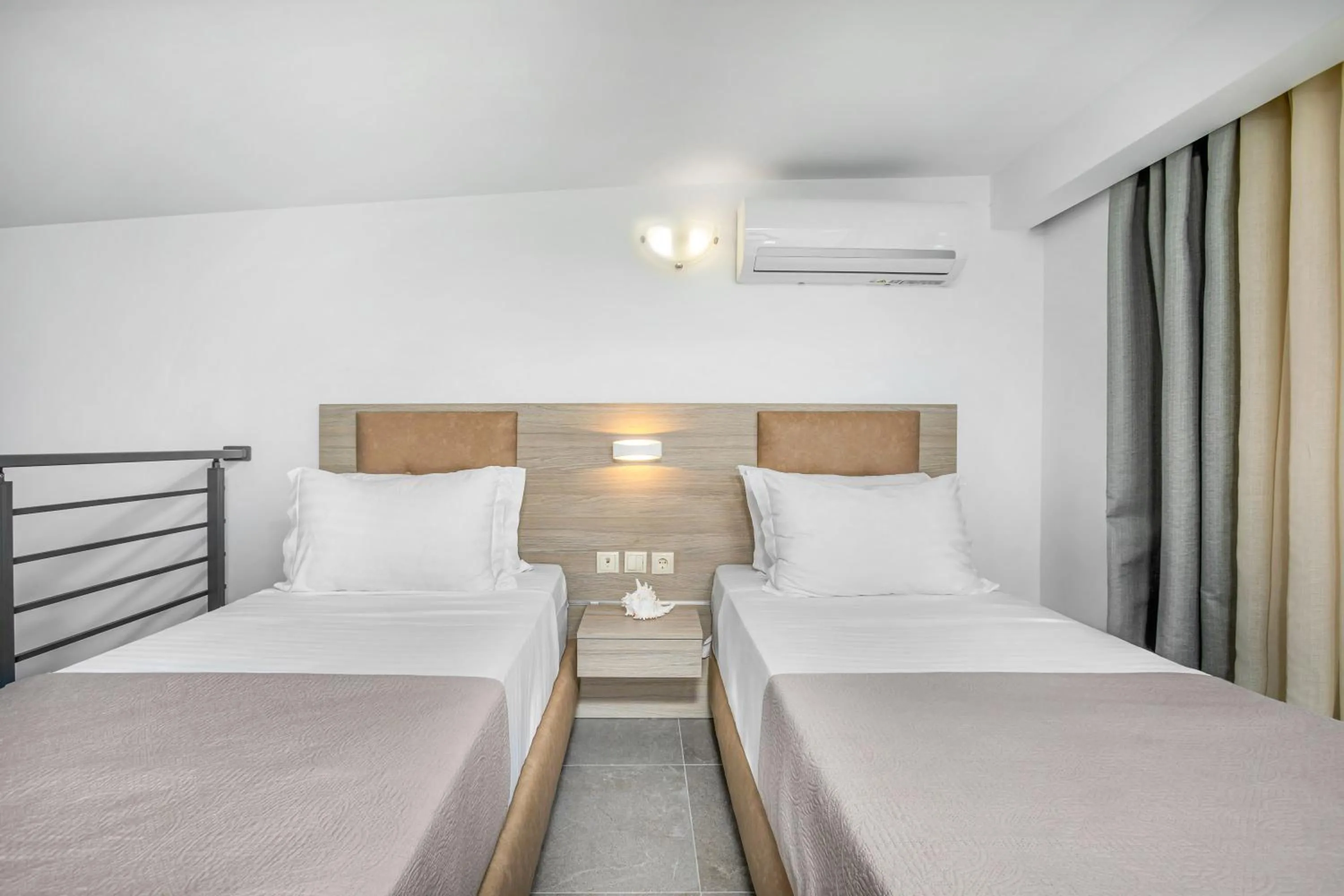 Bed in NewStory Suites Possidi