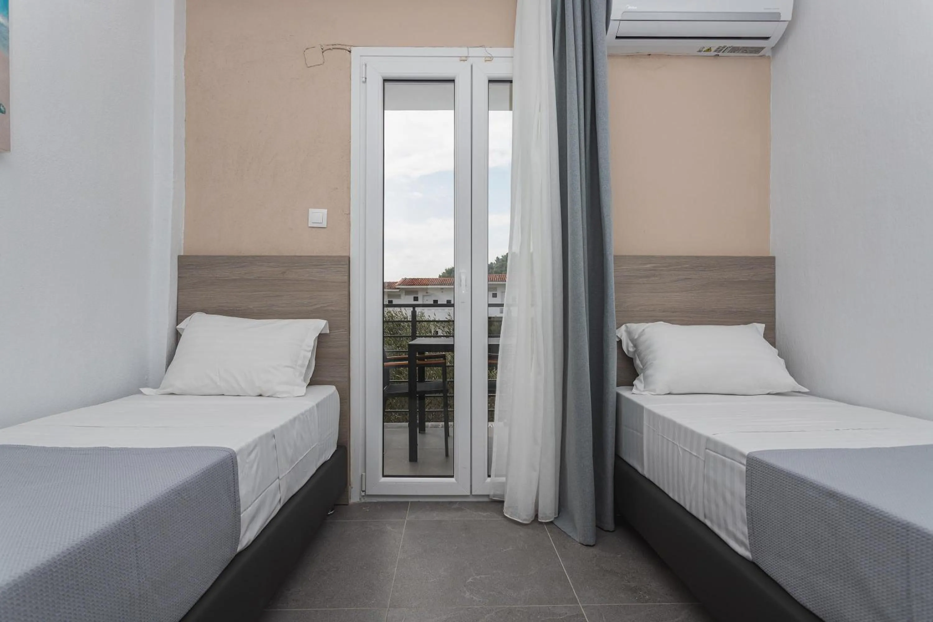 Bedroom, Bed in NewStory Suites Possidi