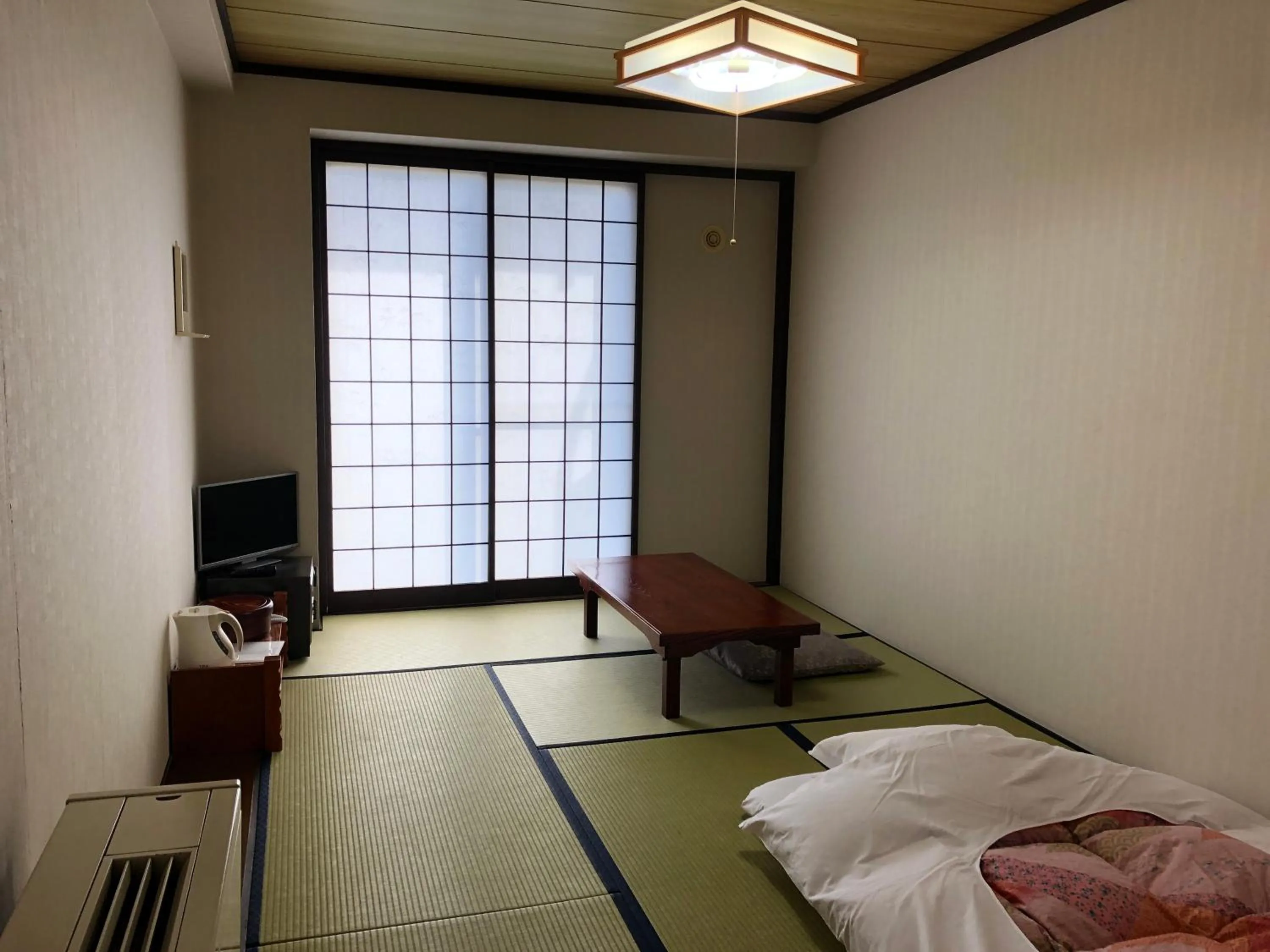 Photo of the whole room, Bed in Hotel Belle-Cour Inomata