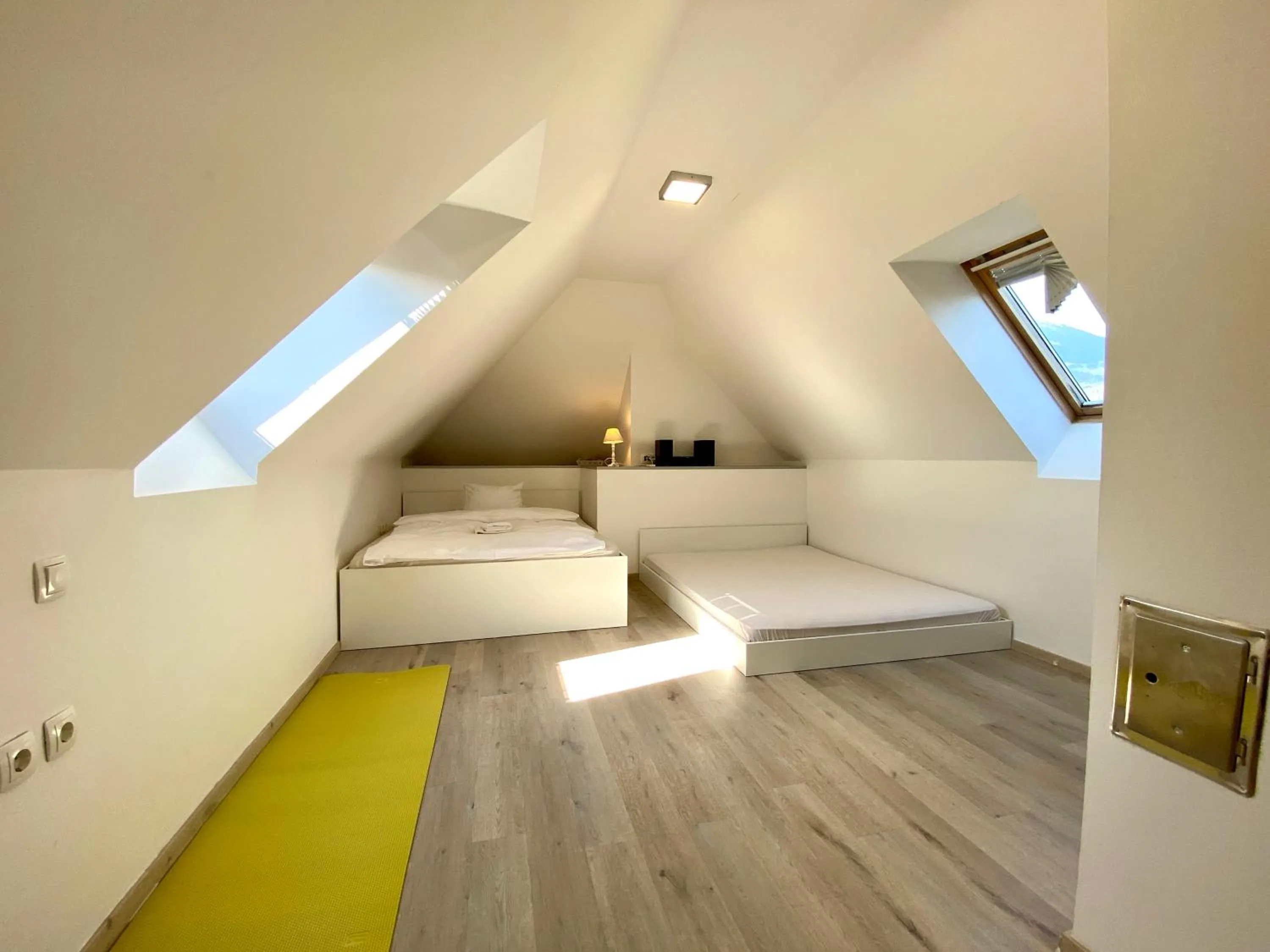 Bed in House Eden with Mountain Views