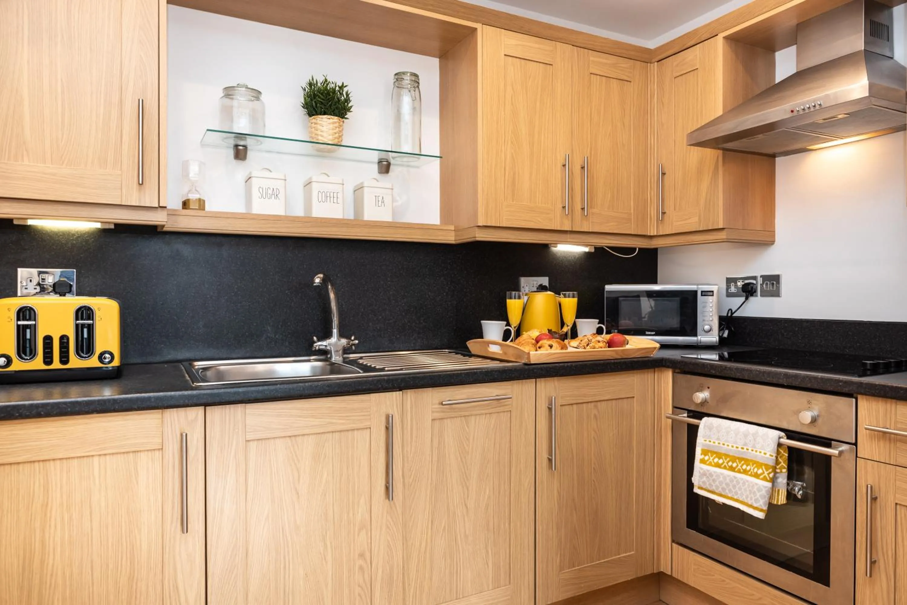 Kitchen or kitchenette in The Old Library - Modern Apartment near the Train Station and Racecourse