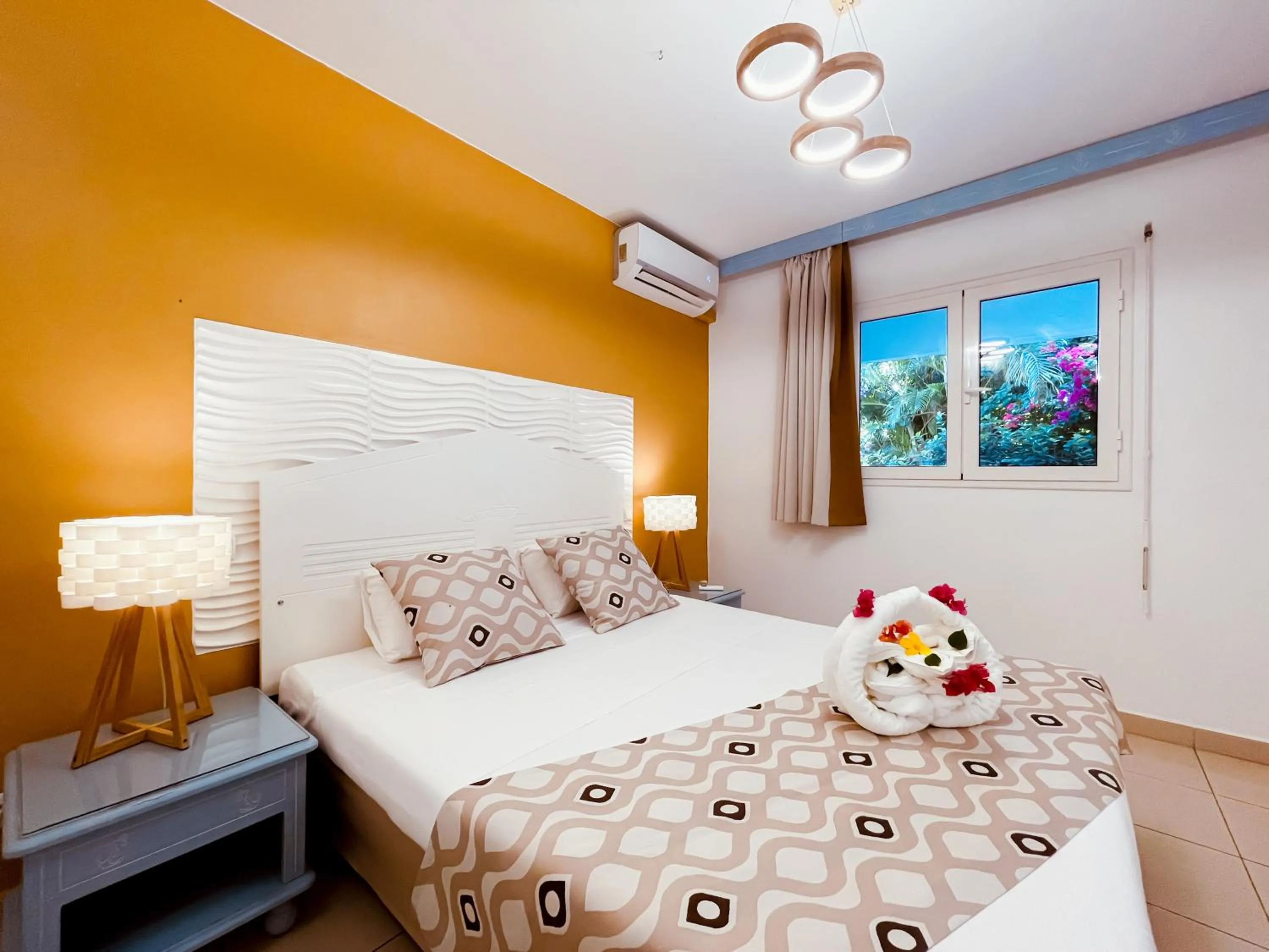 Bed in Tropicana Suites