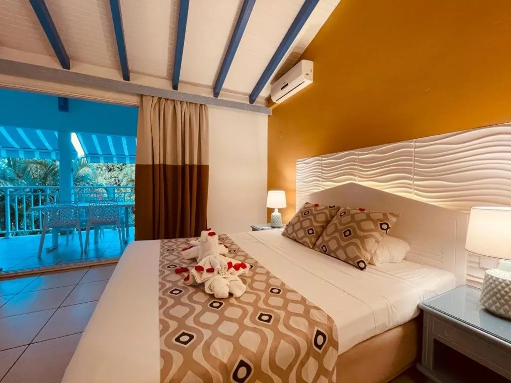Bed in Tropicana Suites