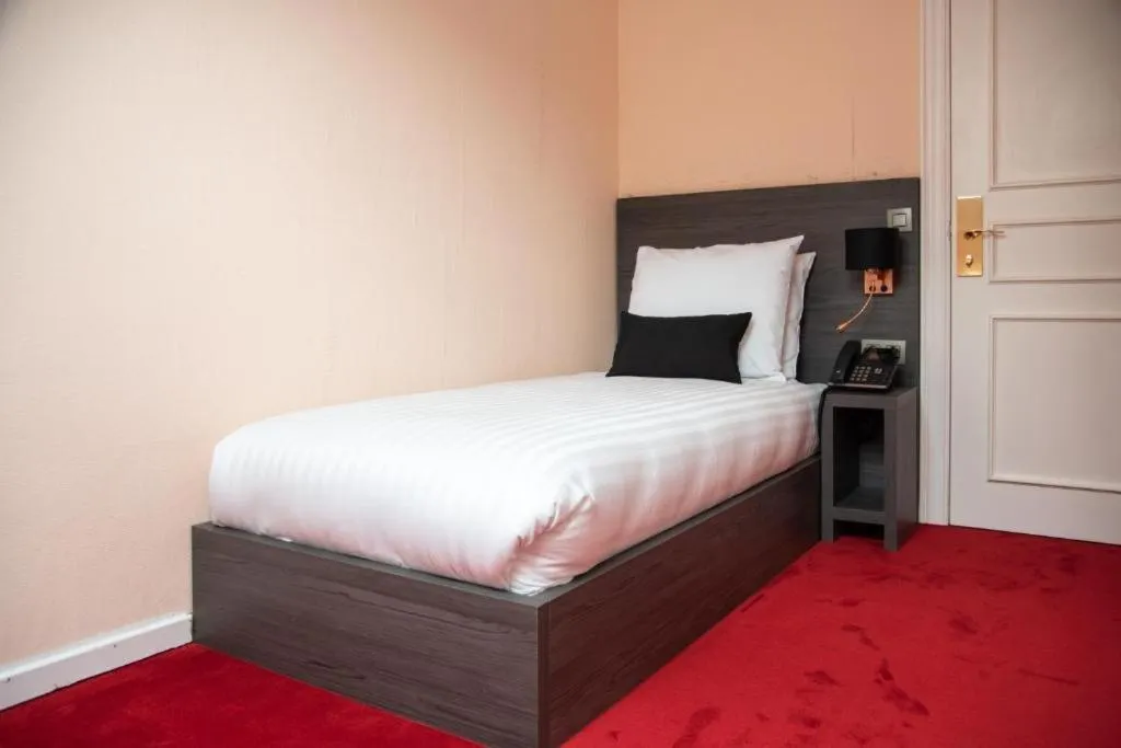 Bed in La Bourse Hotel