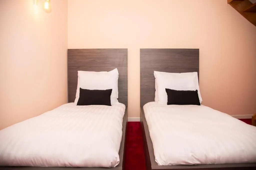 Bed in La Bourse Hotel