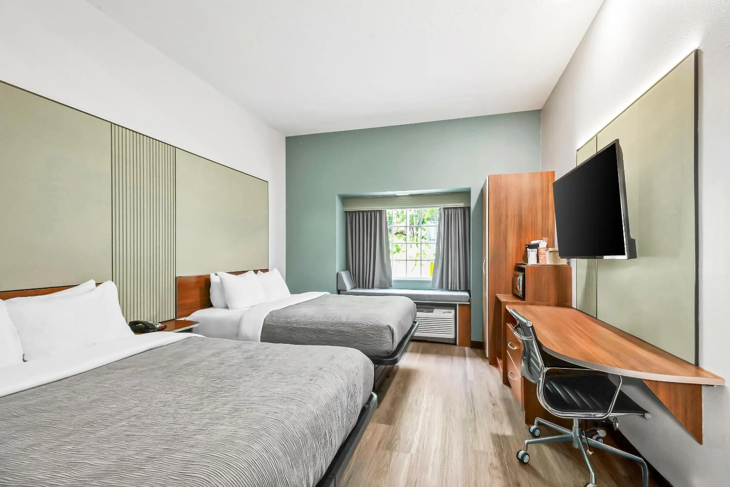 Bed in Quality Inn & Suites