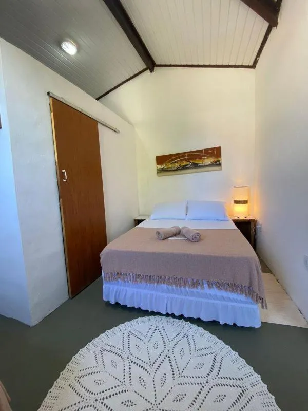 Bed in Pousada Dom Quixote
