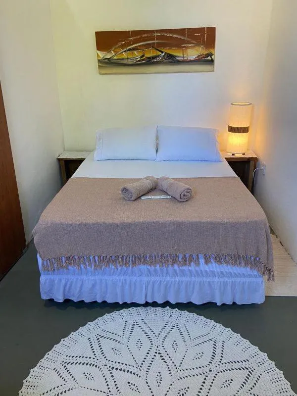 Bed in Pousada Dom Quixote
