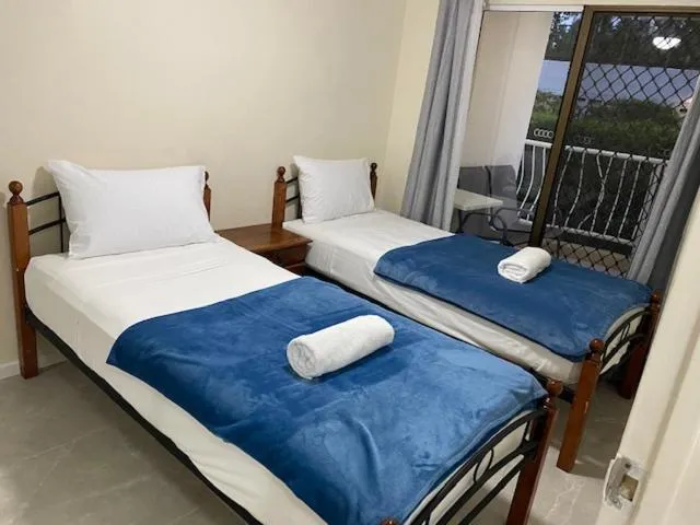 Bed in Anchor Down Holiday Apartments