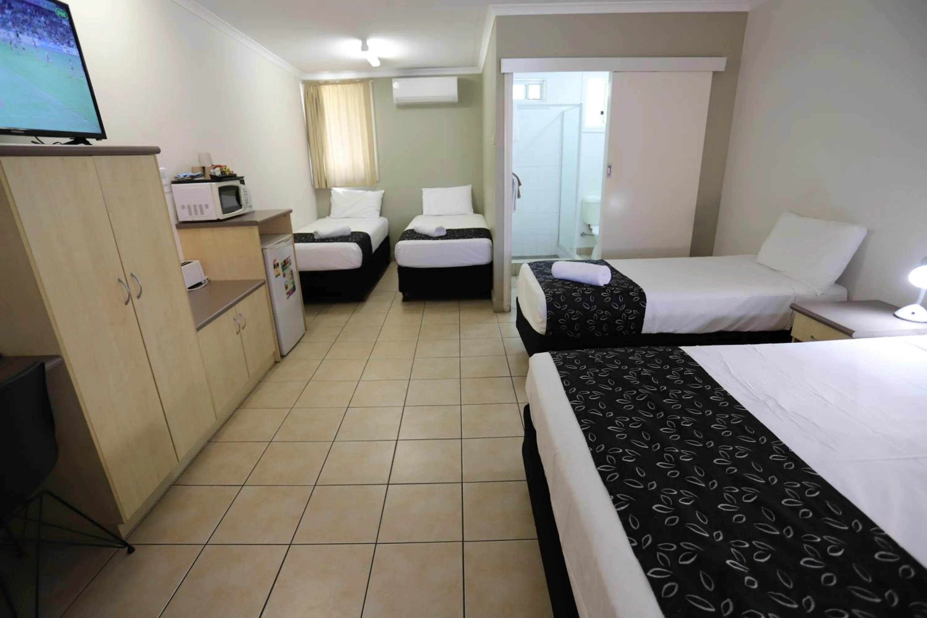 Bed in Tropic Coast Motel