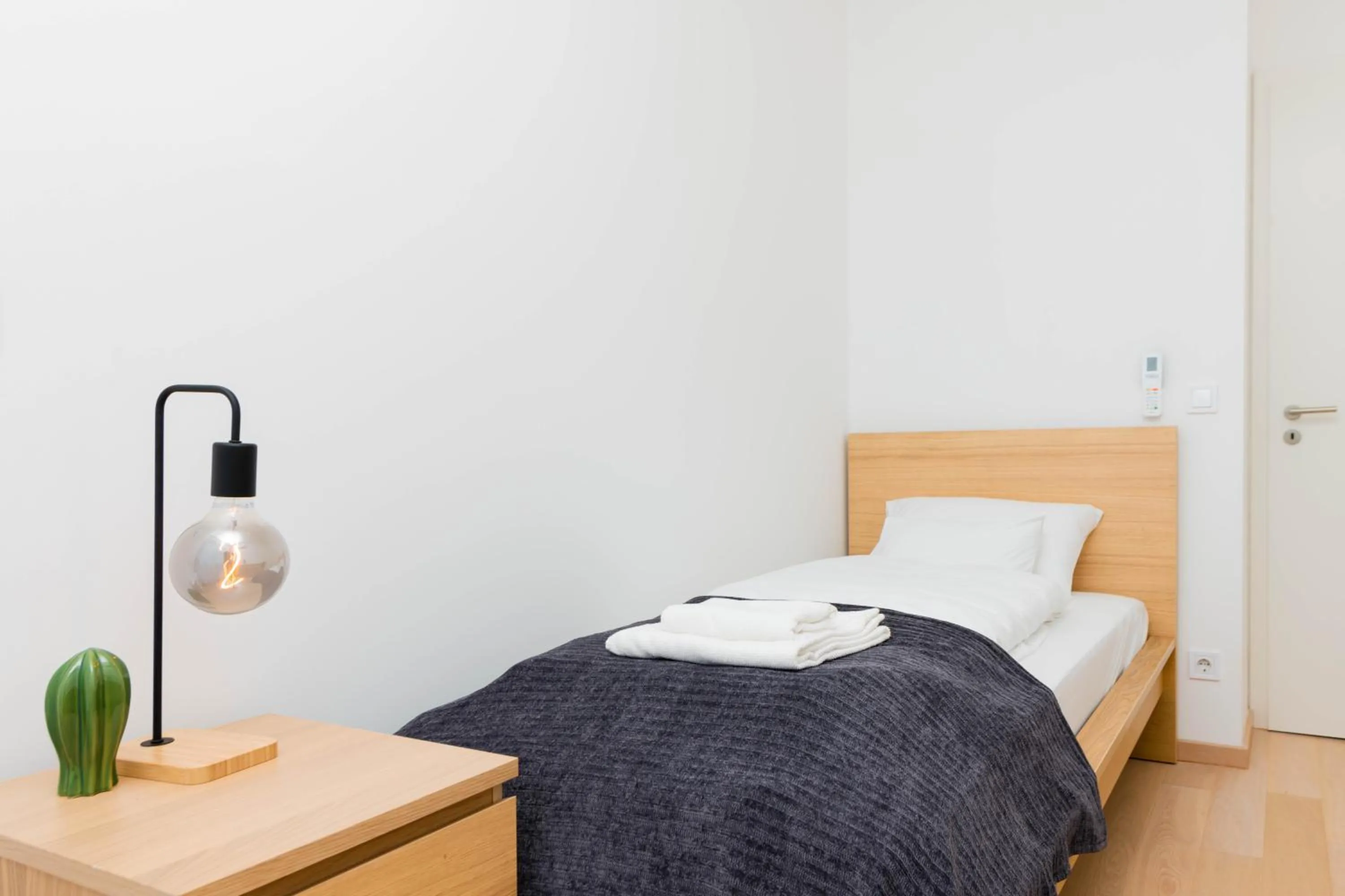 Bed in Elisabeth Downtown Apartments by FirstHost