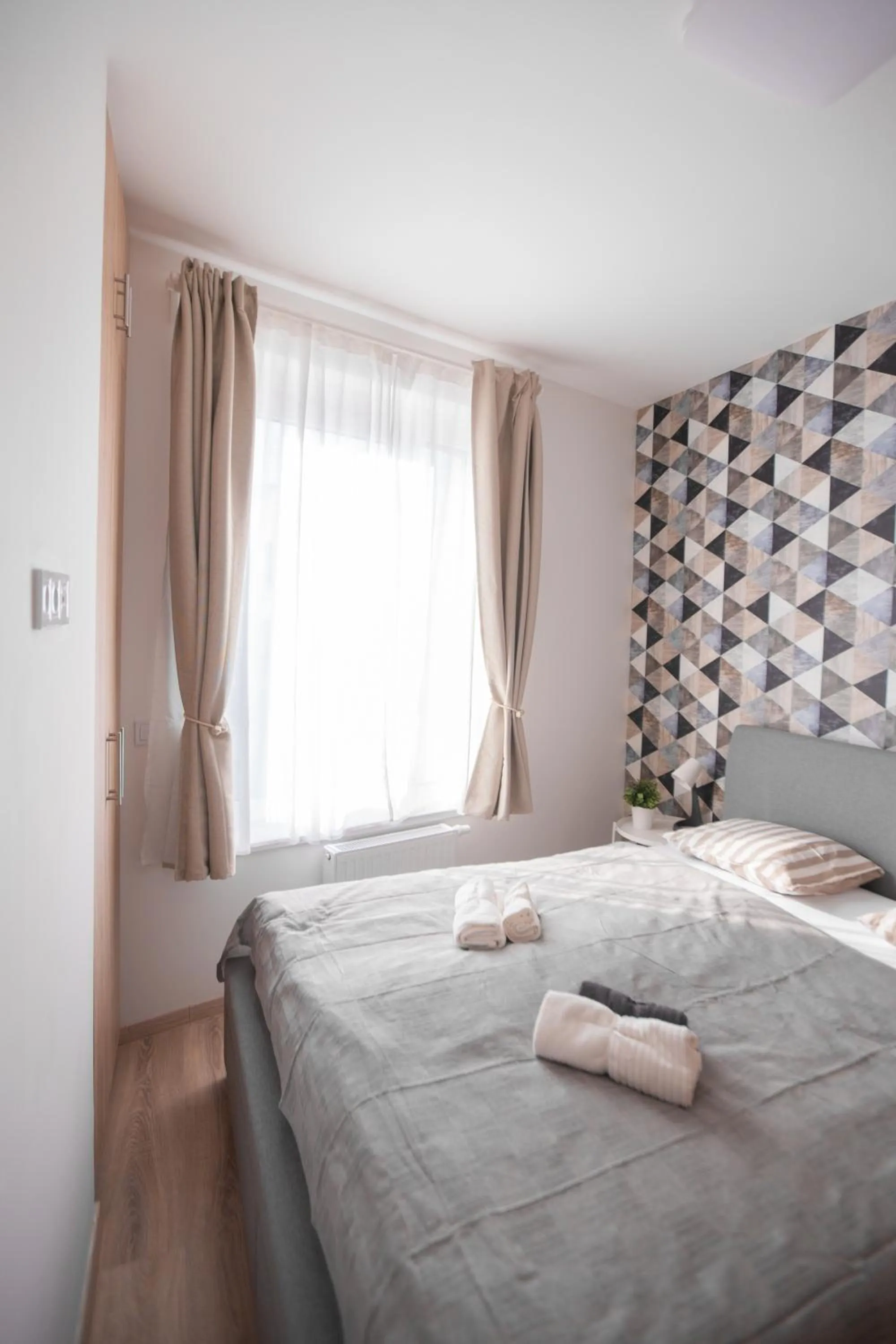 Bed in Elisabeth Downtown Apartments by FirstHost