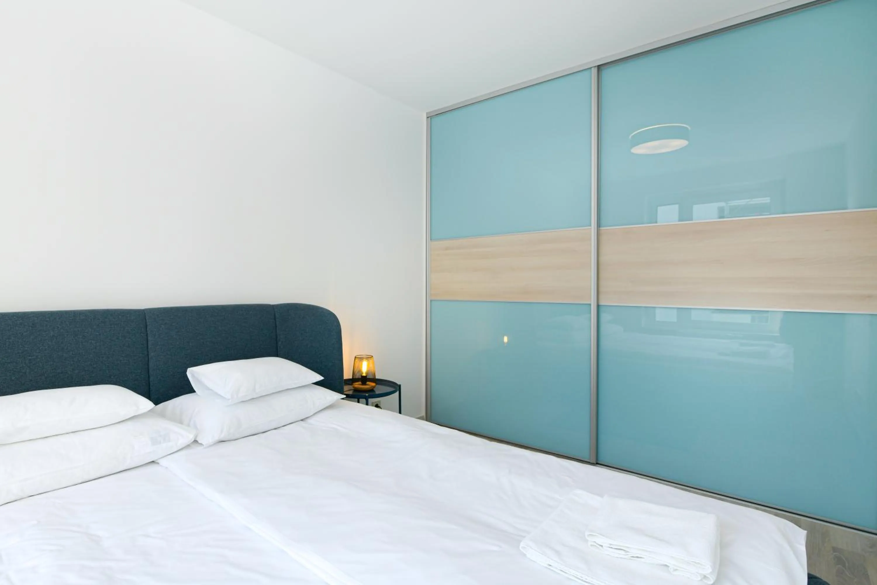 Bed in Elisabeth Downtown Apartments by FirstHost