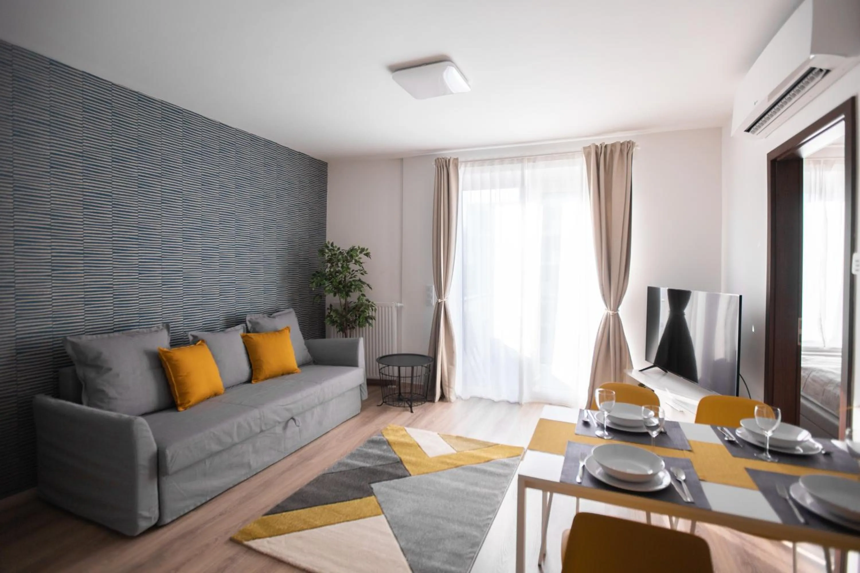 Communal lounge/ TV room in Elisabeth Downtown Apartments by FirstHost