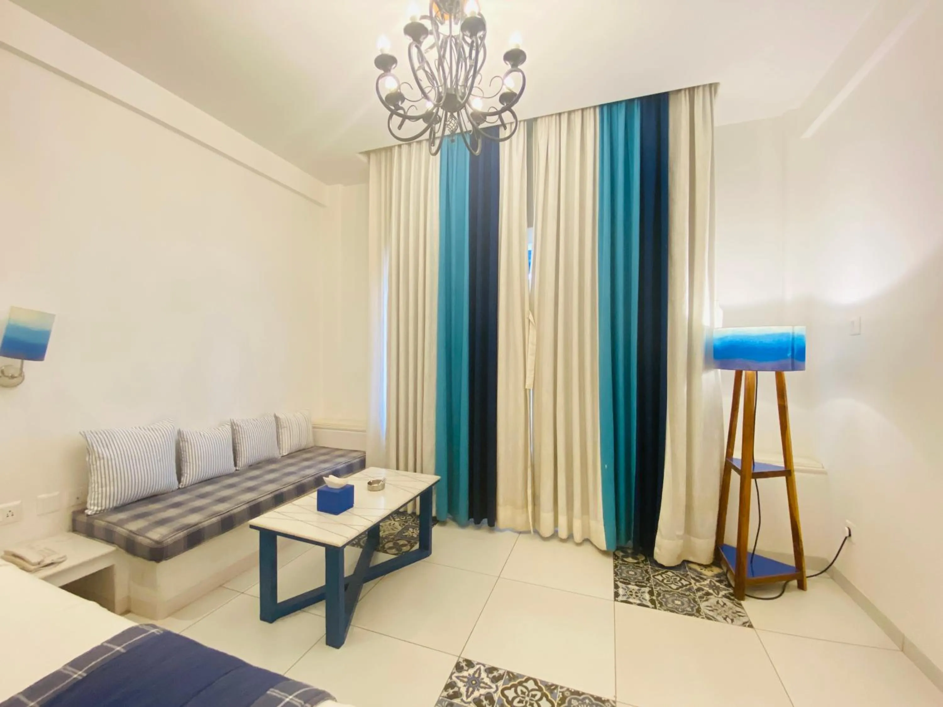 Seating area, Bed in Ananda Resorts Shantiniketan