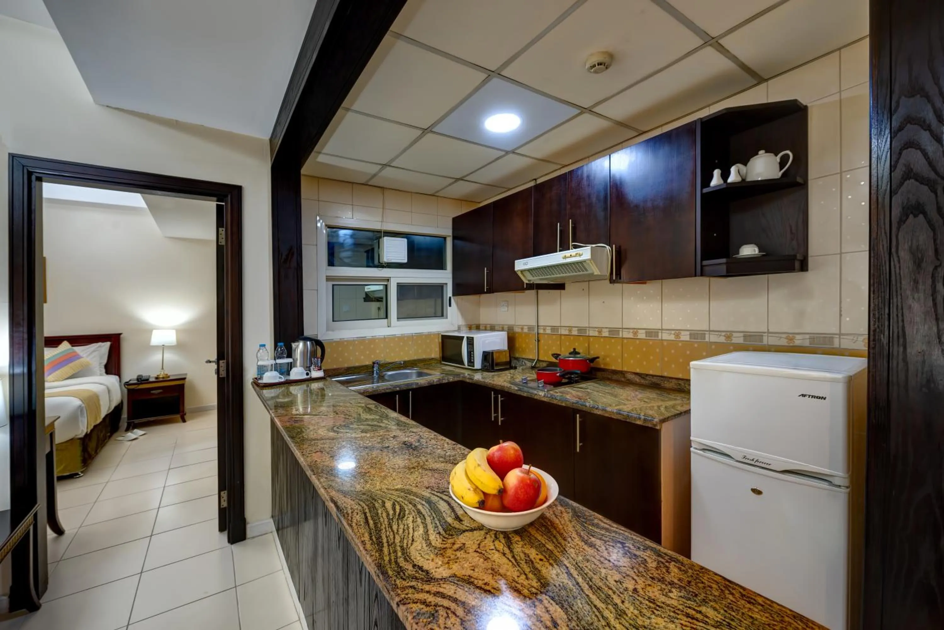 Kitchen or kitchenette in Al Hayat Hotel Apartments
