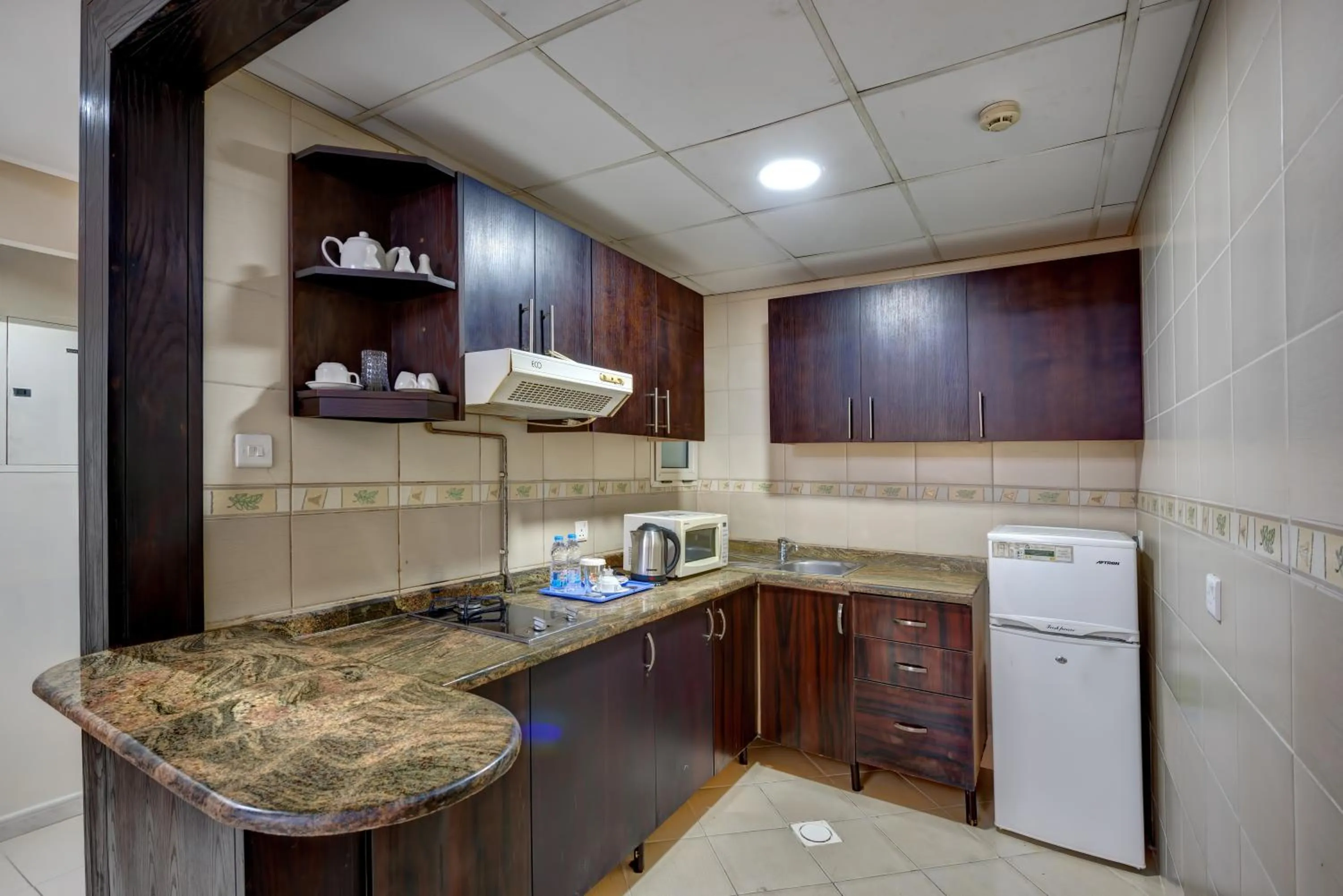 Kitchen or kitchenette in Al Hayat Hotel Apartments