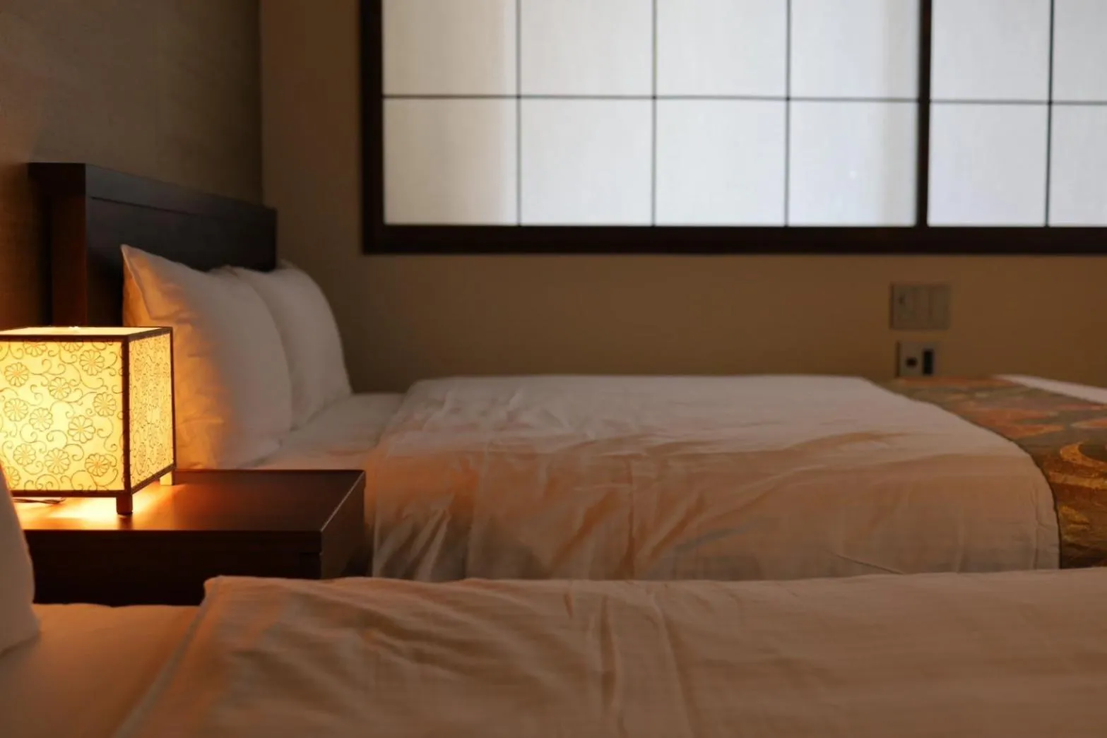 Bed in Hotel Rakurakuan