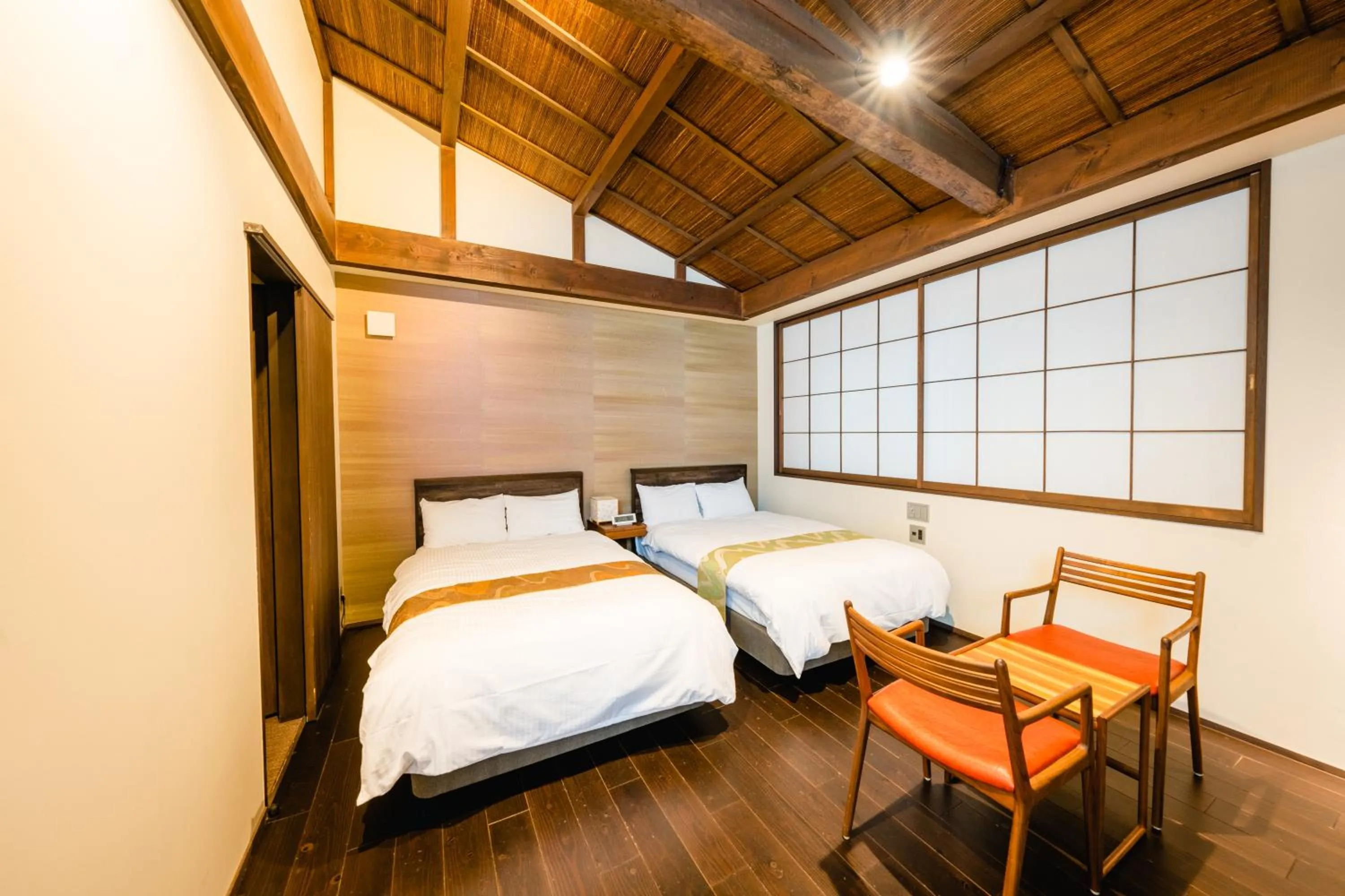 Bed in Hotel Rakurakuan