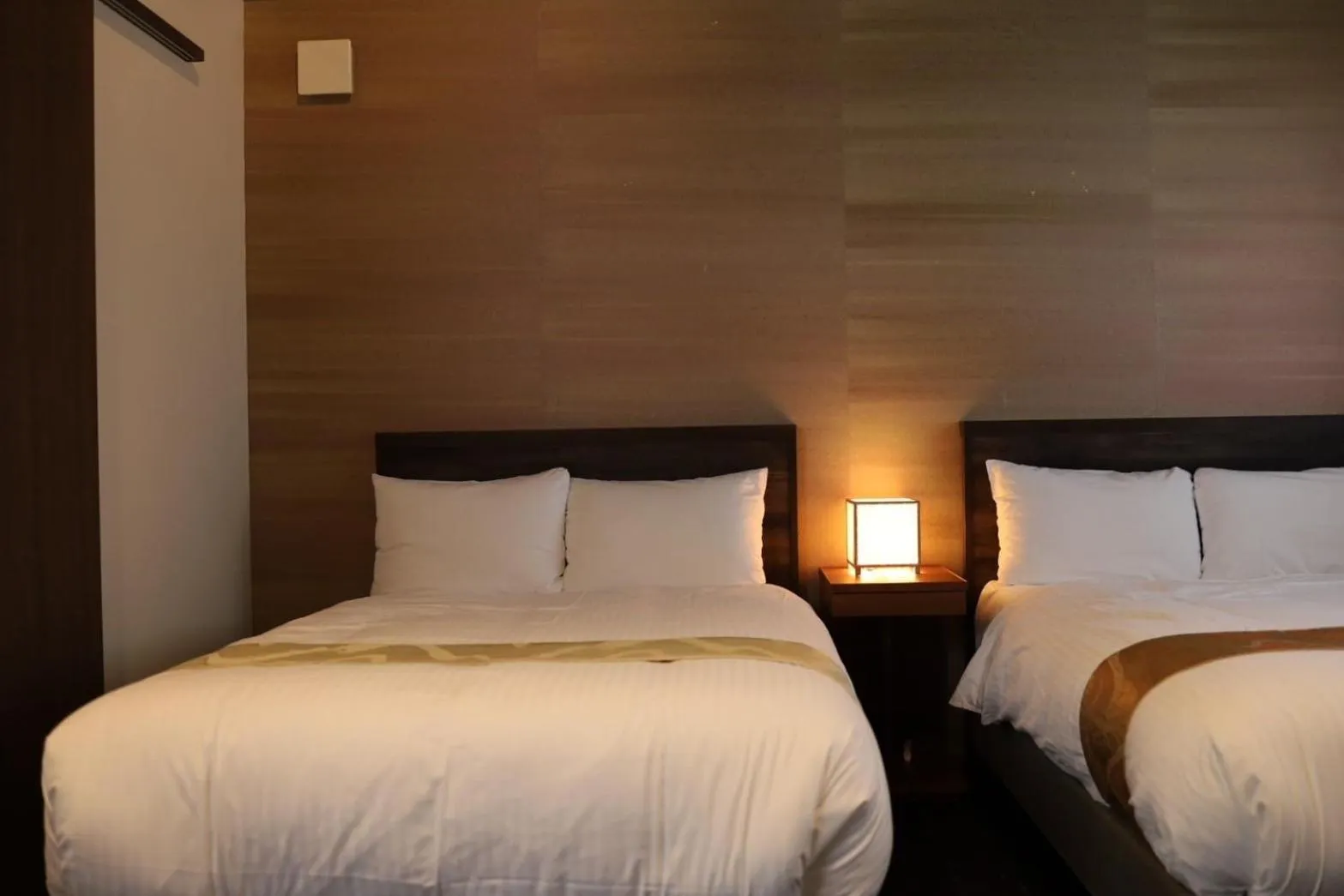 Bed in Hotel Rakurakuan