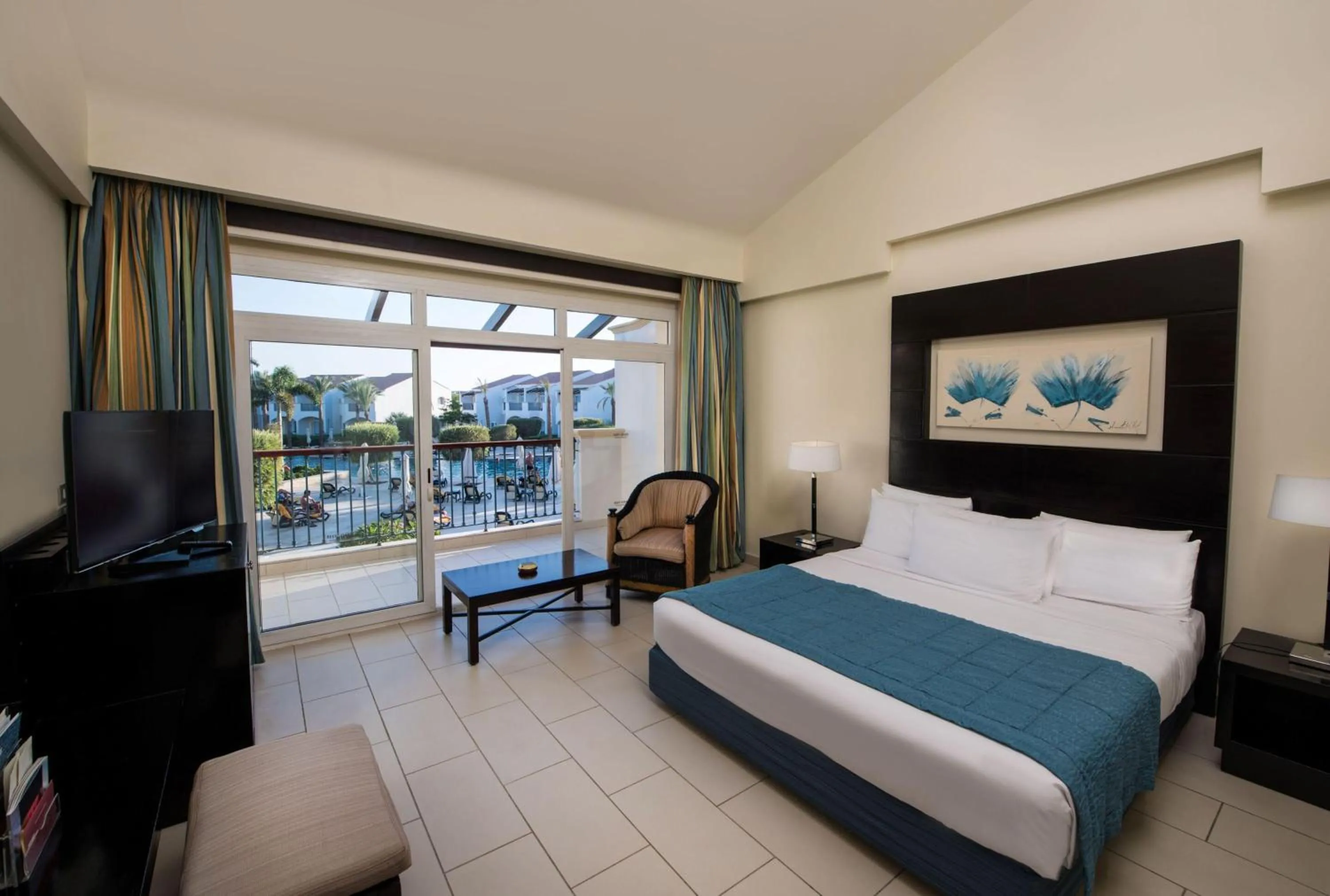 Photo of the whole room, Bed in Reef Oasis Blue Bay Resort & Spa