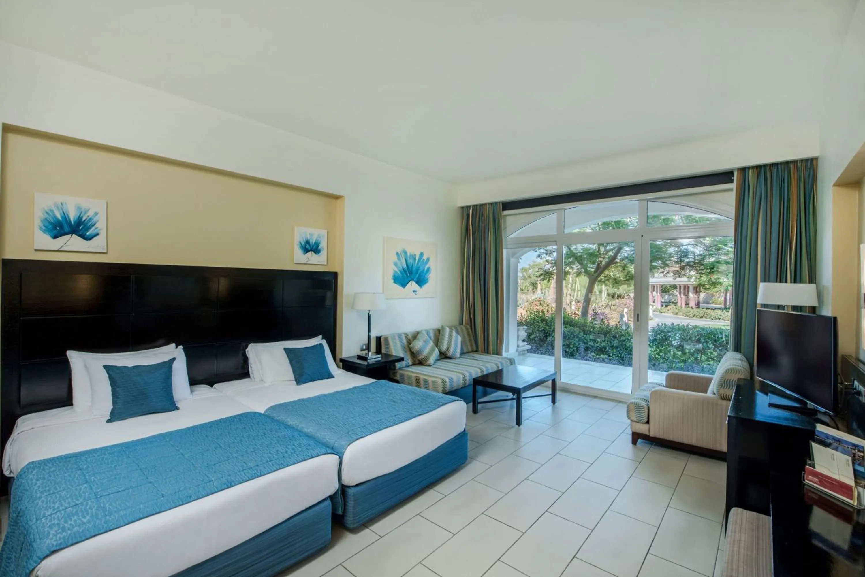 Photo of the whole room, Bed in Reef Oasis Blue Bay Resort & Spa