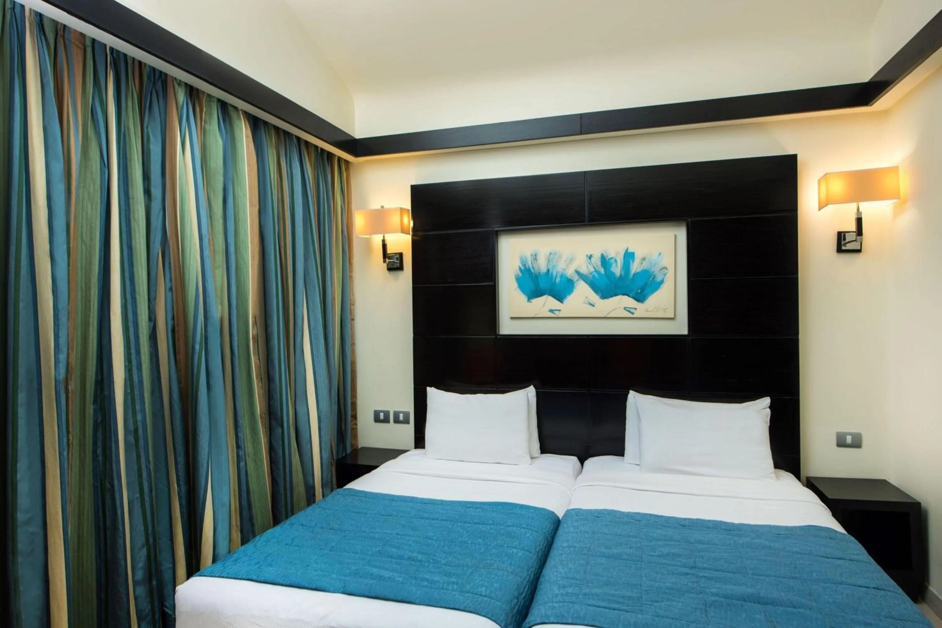 Photo of the whole room, Bed in Reef Oasis Blue Bay Resort & Spa