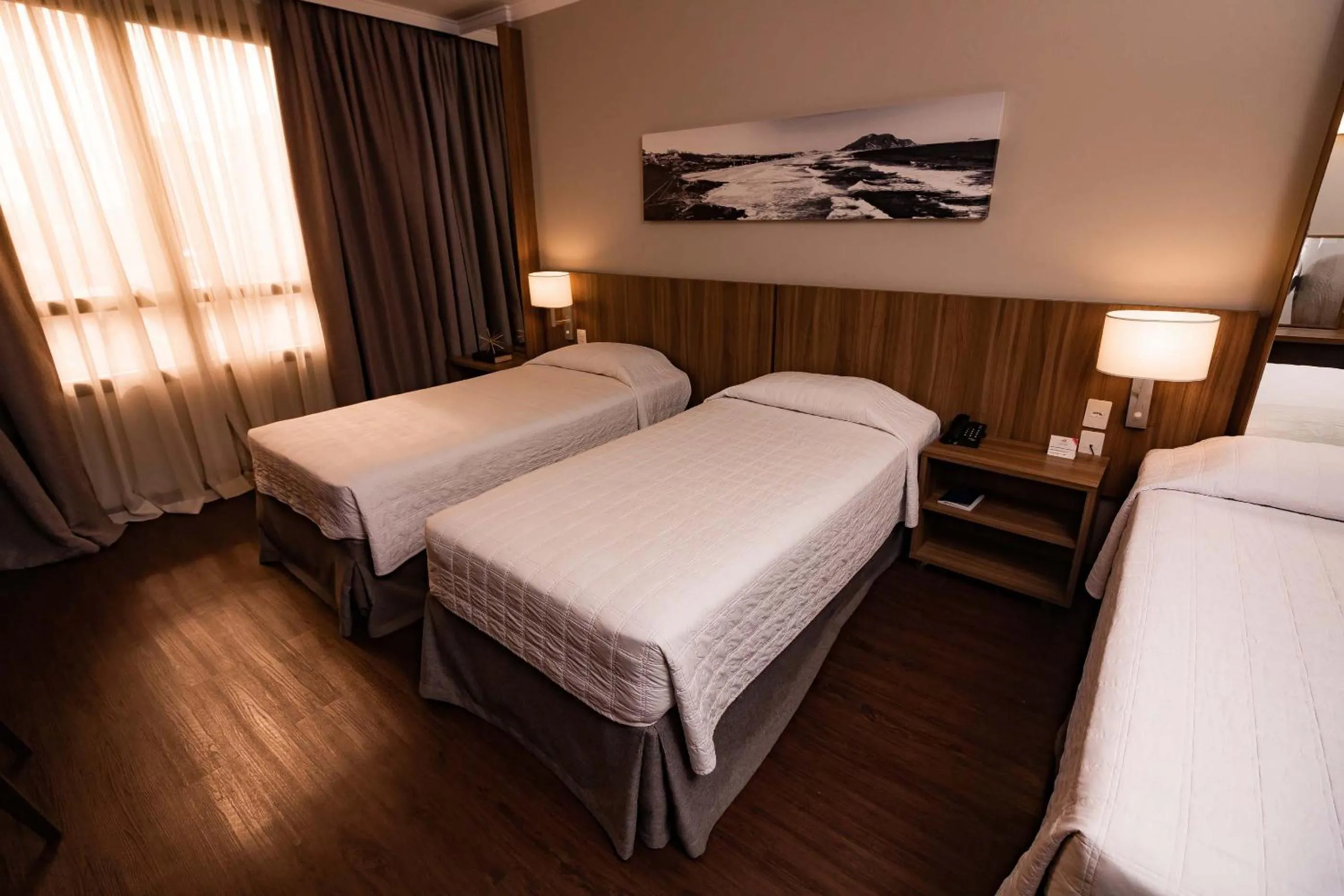 Bed in Kennedy Executive Hotel