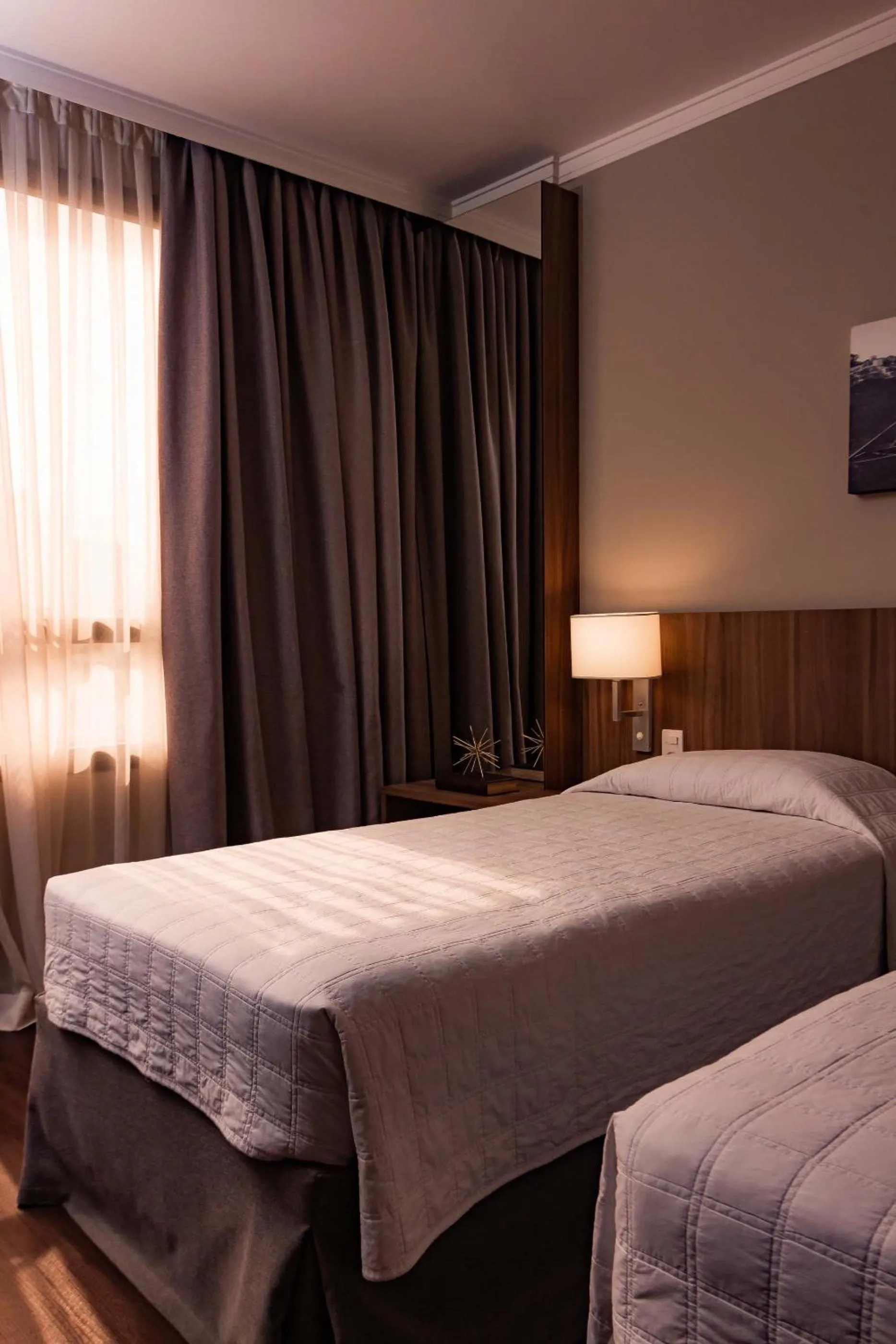 Bed in Kennedy Executive Hotel