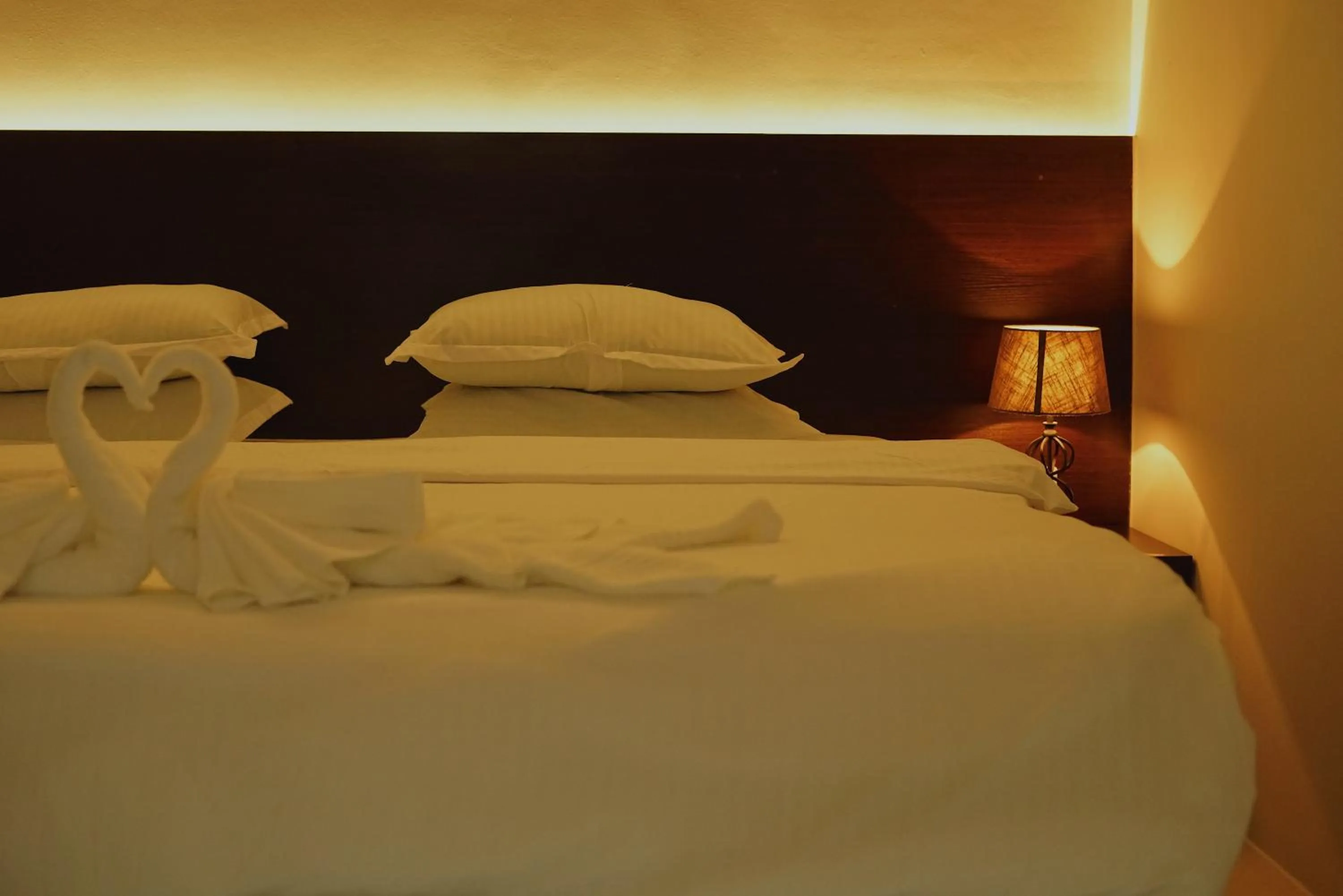 Bed in Violet Inn Hotel