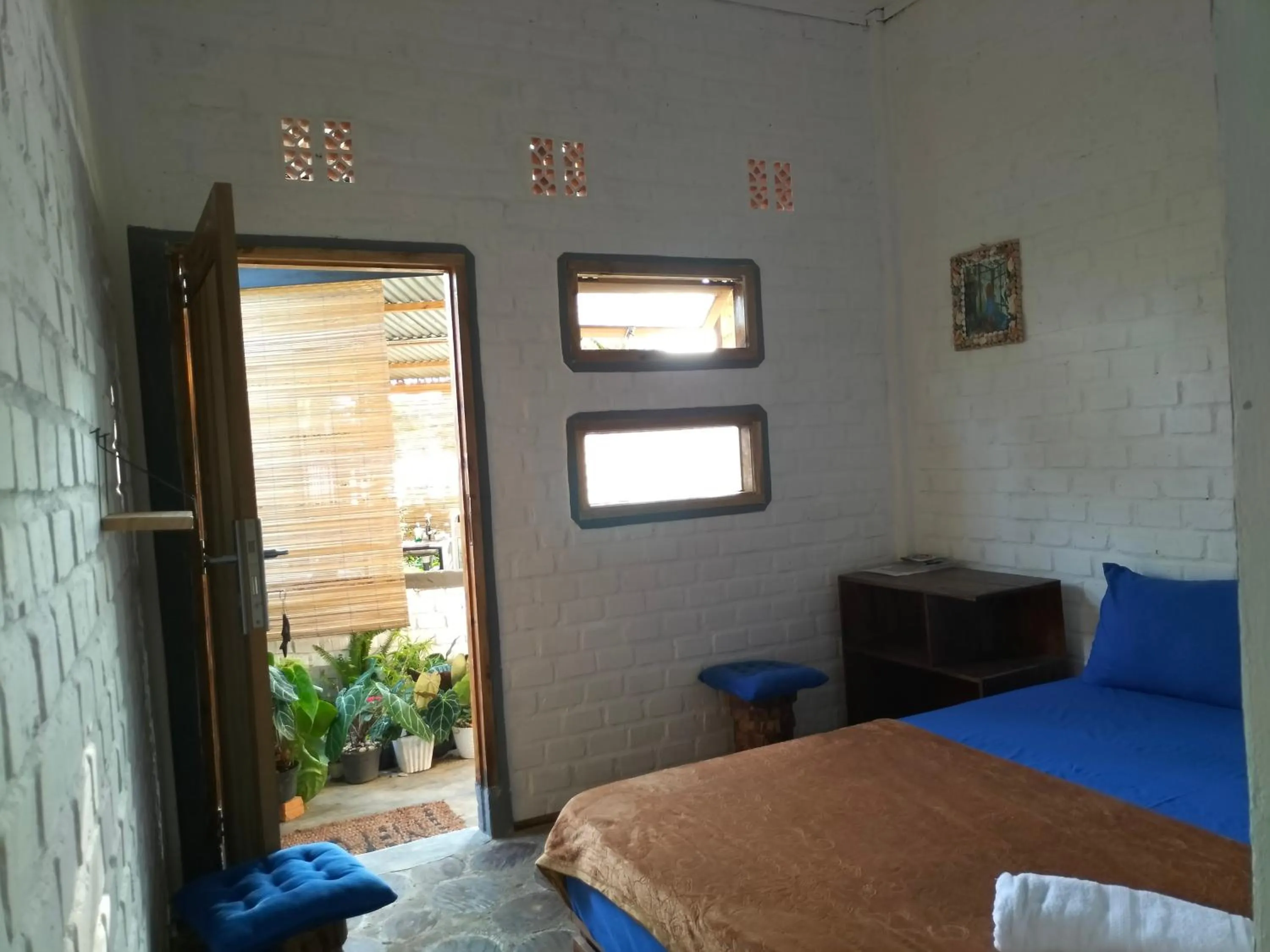 Bed in AZALEA GARDEN HOMESTAY