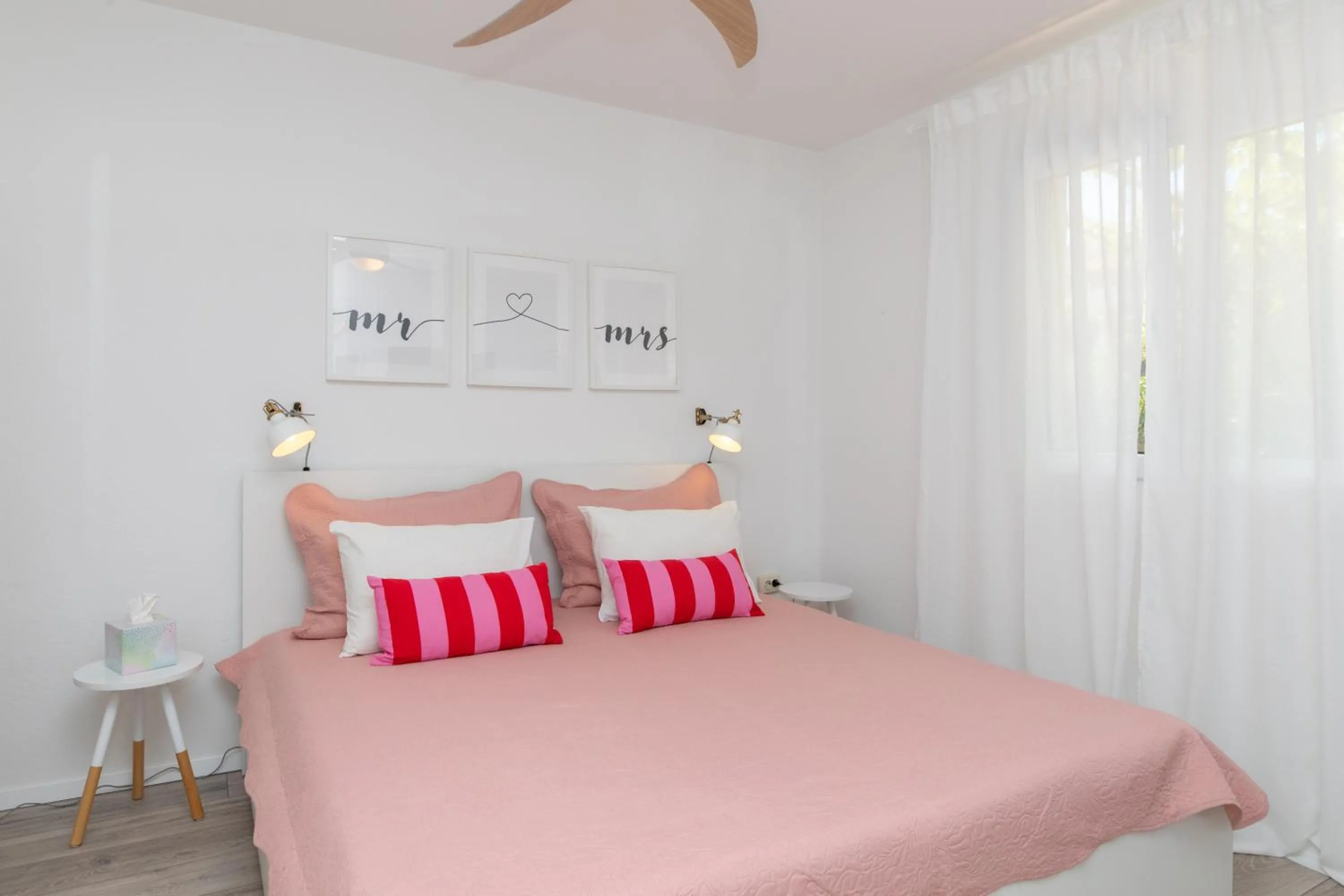 Bed in Two Flowers Luxury Apartment