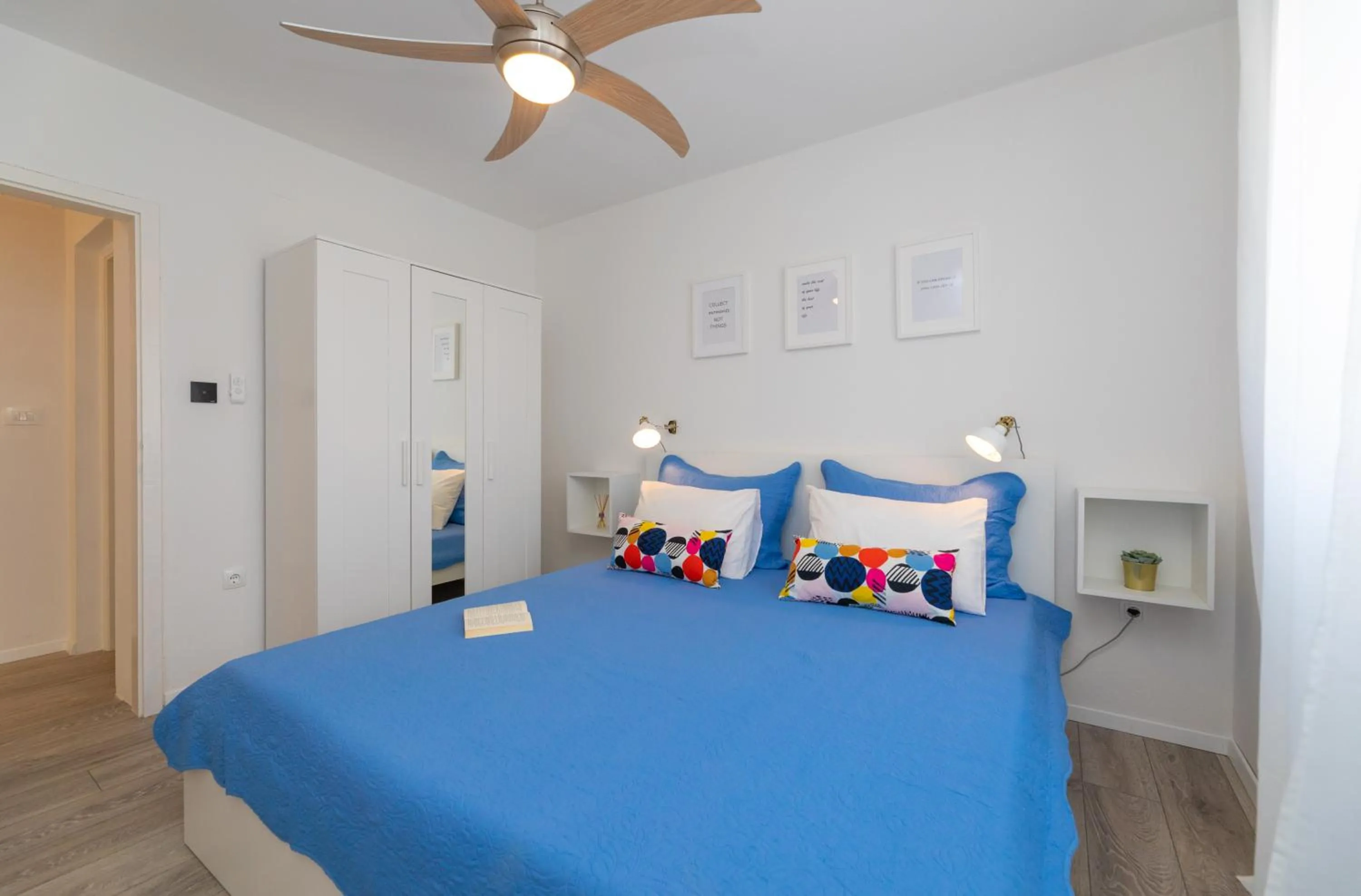 Bed in Two Flowers Luxury Apartment