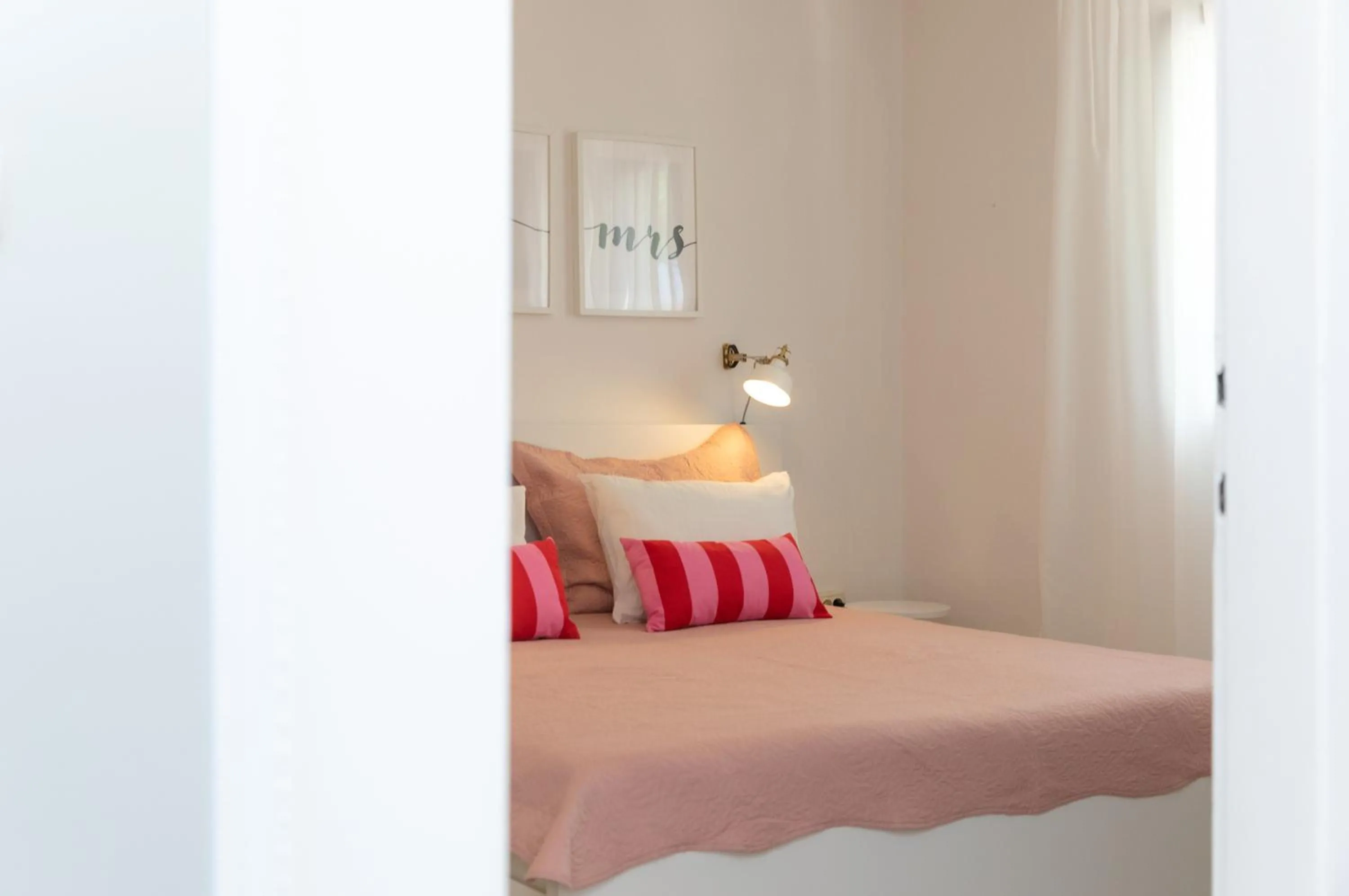 Bed in Two Flowers Luxury Apartment