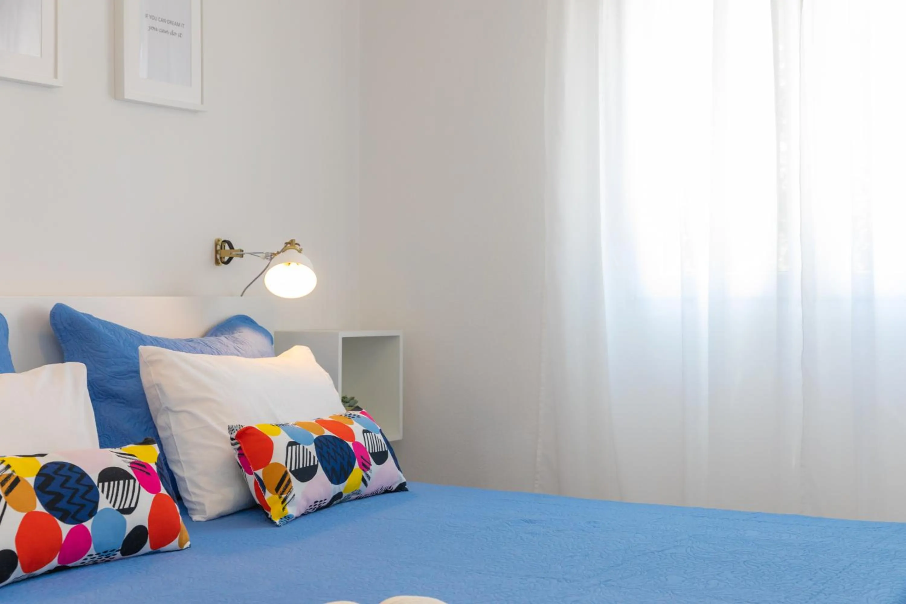 Bed in Two Flowers Luxury Apartment