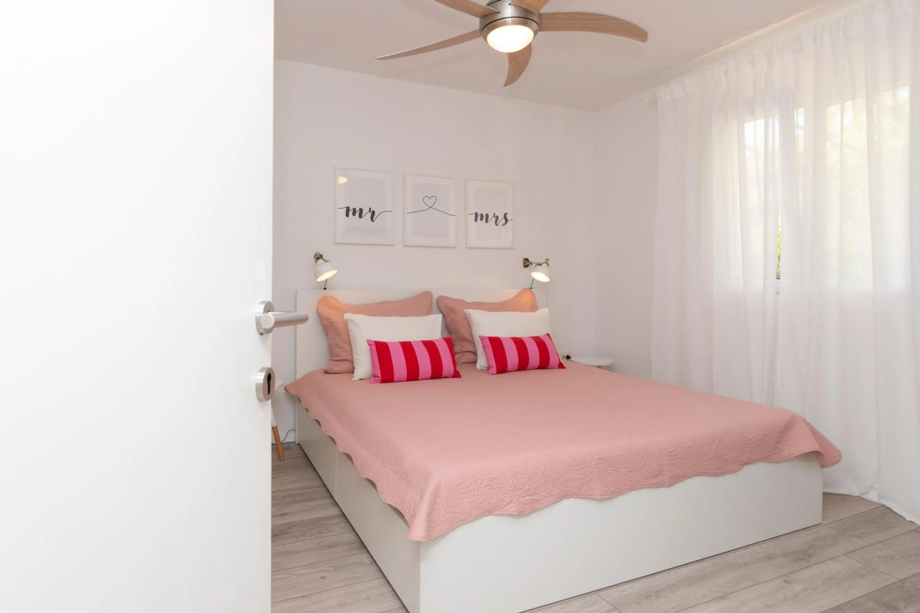 Bed in Two Flowers Luxury Apartment