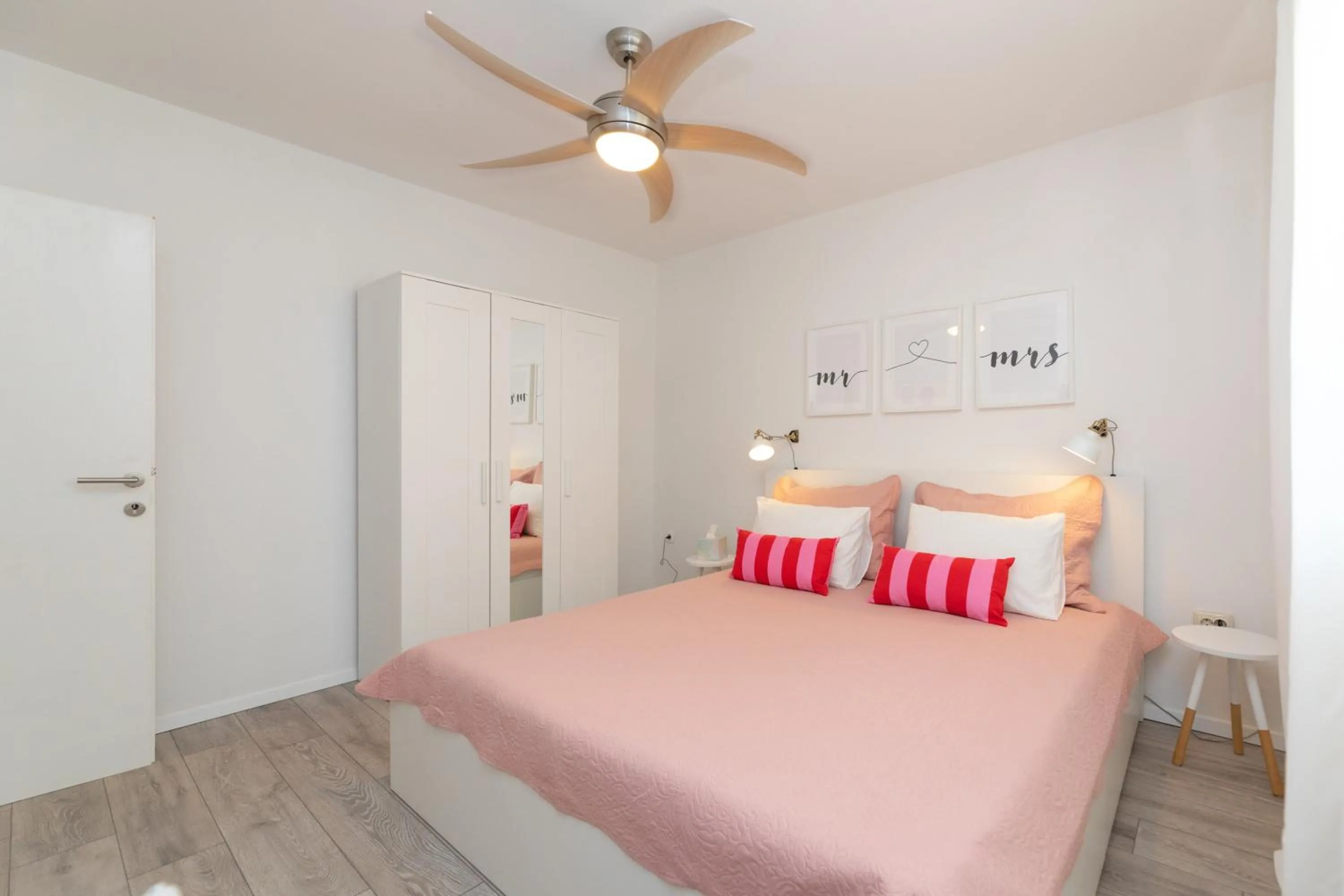 Bed in Two Flowers Luxury Apartment