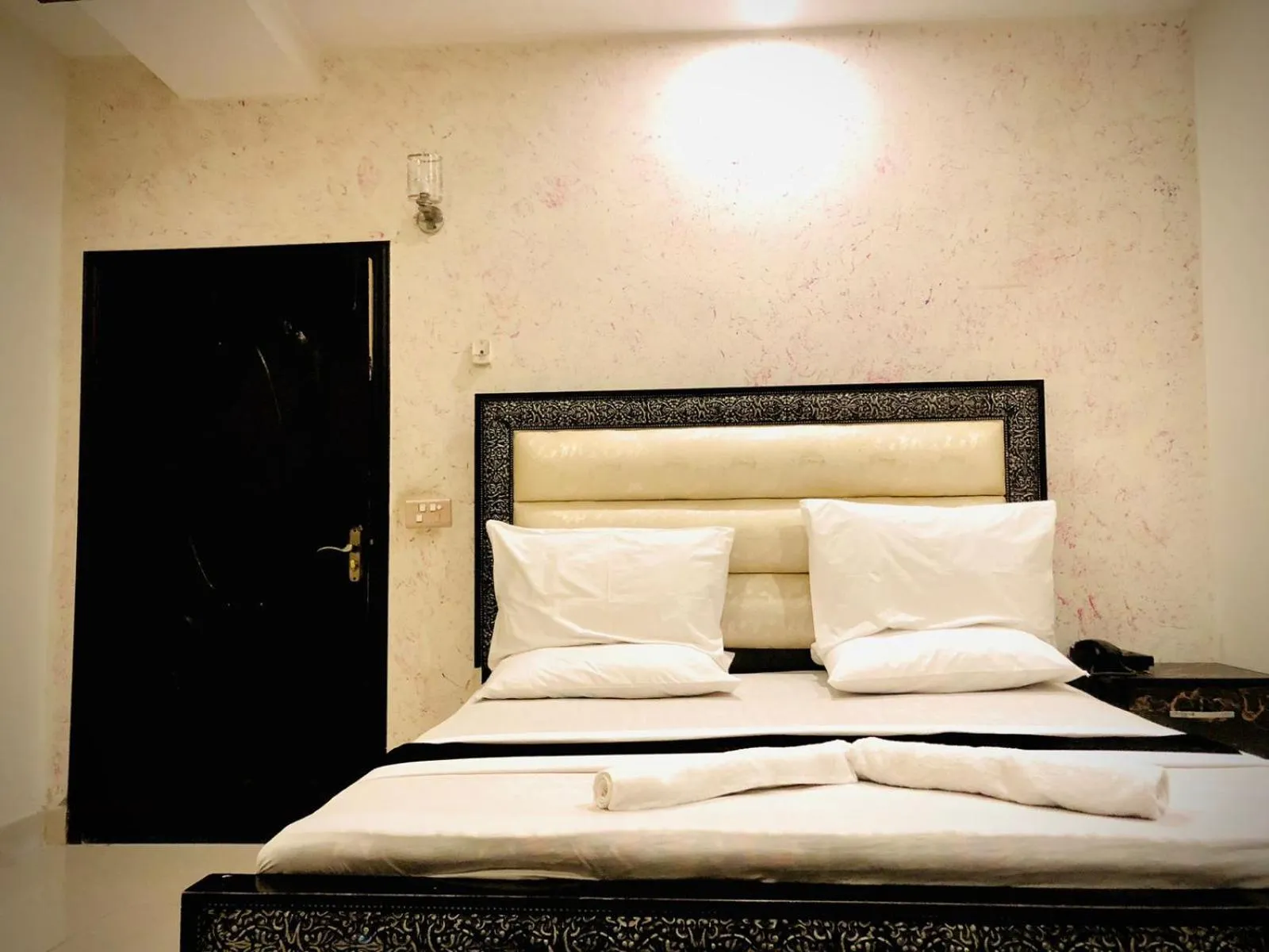 Bed in Hotel Tulip Inn