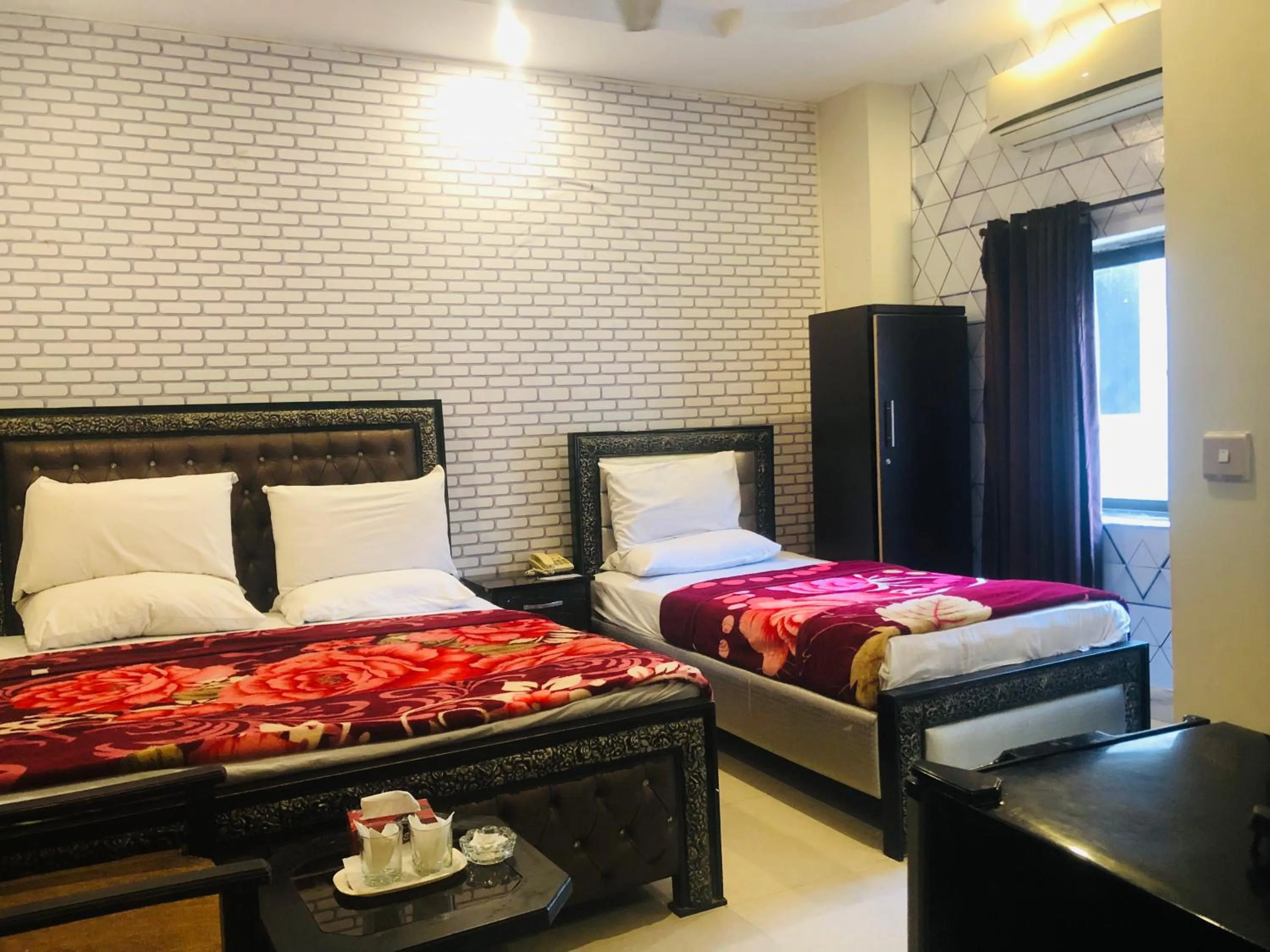 Bed in Hotel Tulip Inn