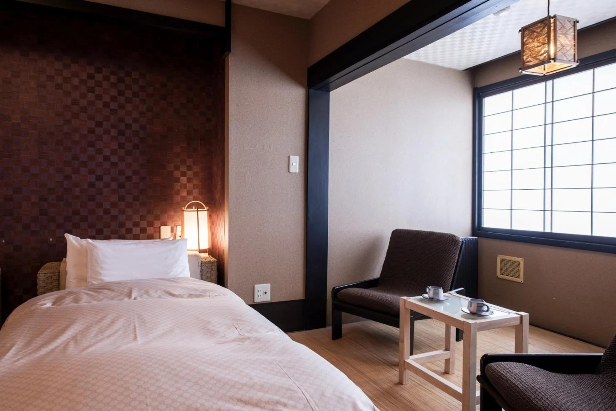 Bed in Takamiya Ryokan Miyamaso