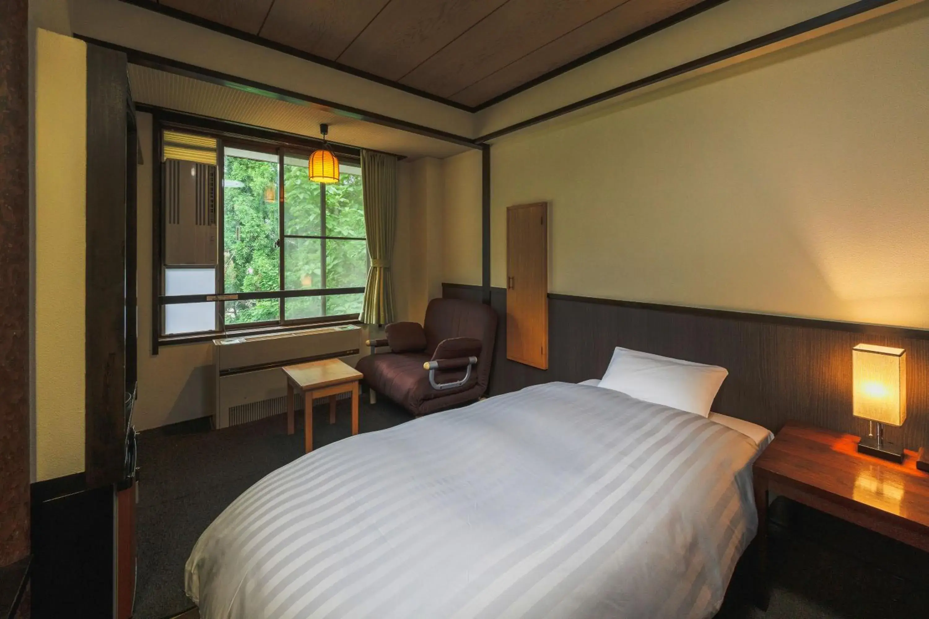 Bed in Takamiya Hotel Hammond Bed in Takamiya Hotel Hammond