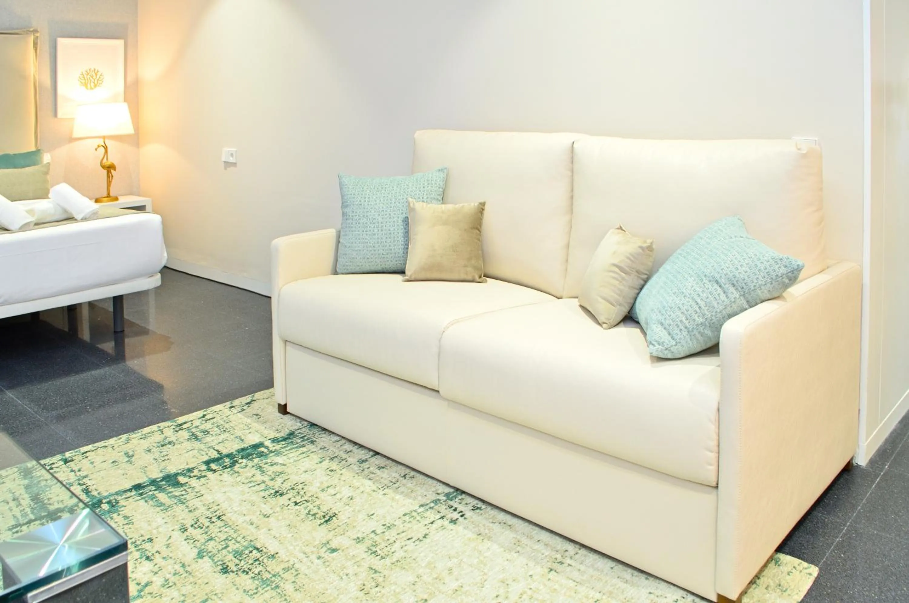 Seating area, Bed in Holihome Rambla 24