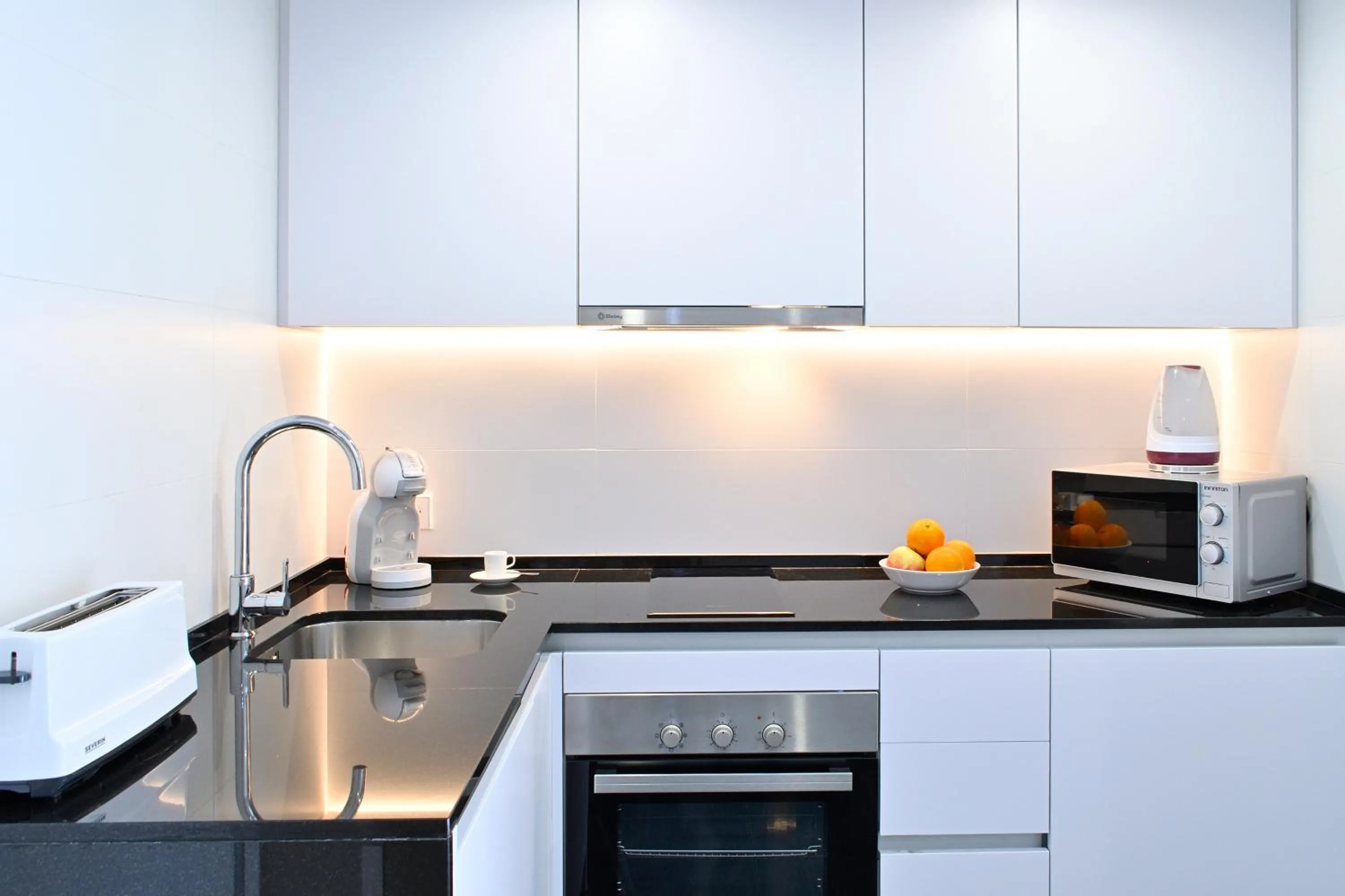 Kitchen or kitchenette in Holihome Rambla 24