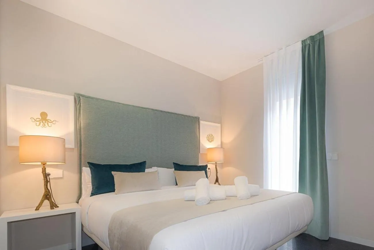 Bed in Holihome Rambla 24