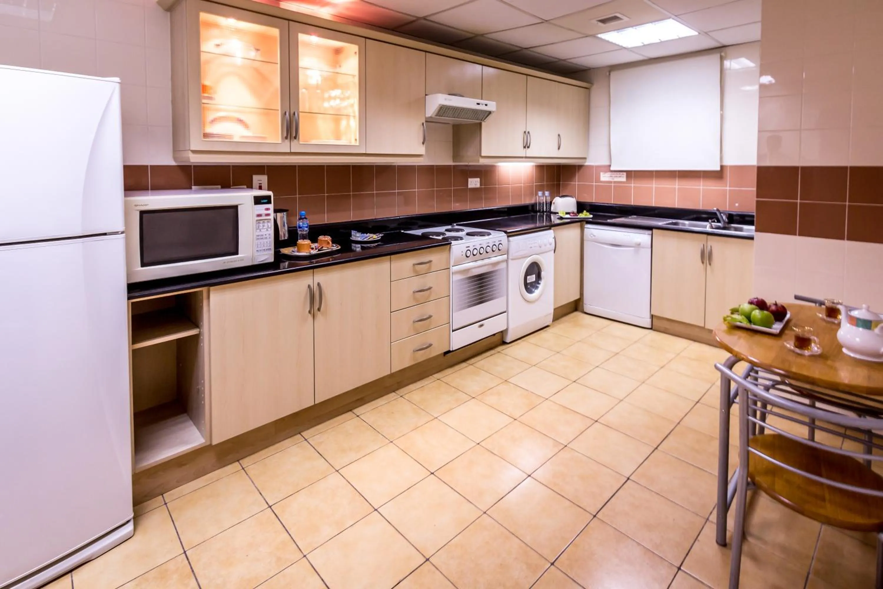 Kitchen or kitchenette in Elite Seef Residence And Hotel