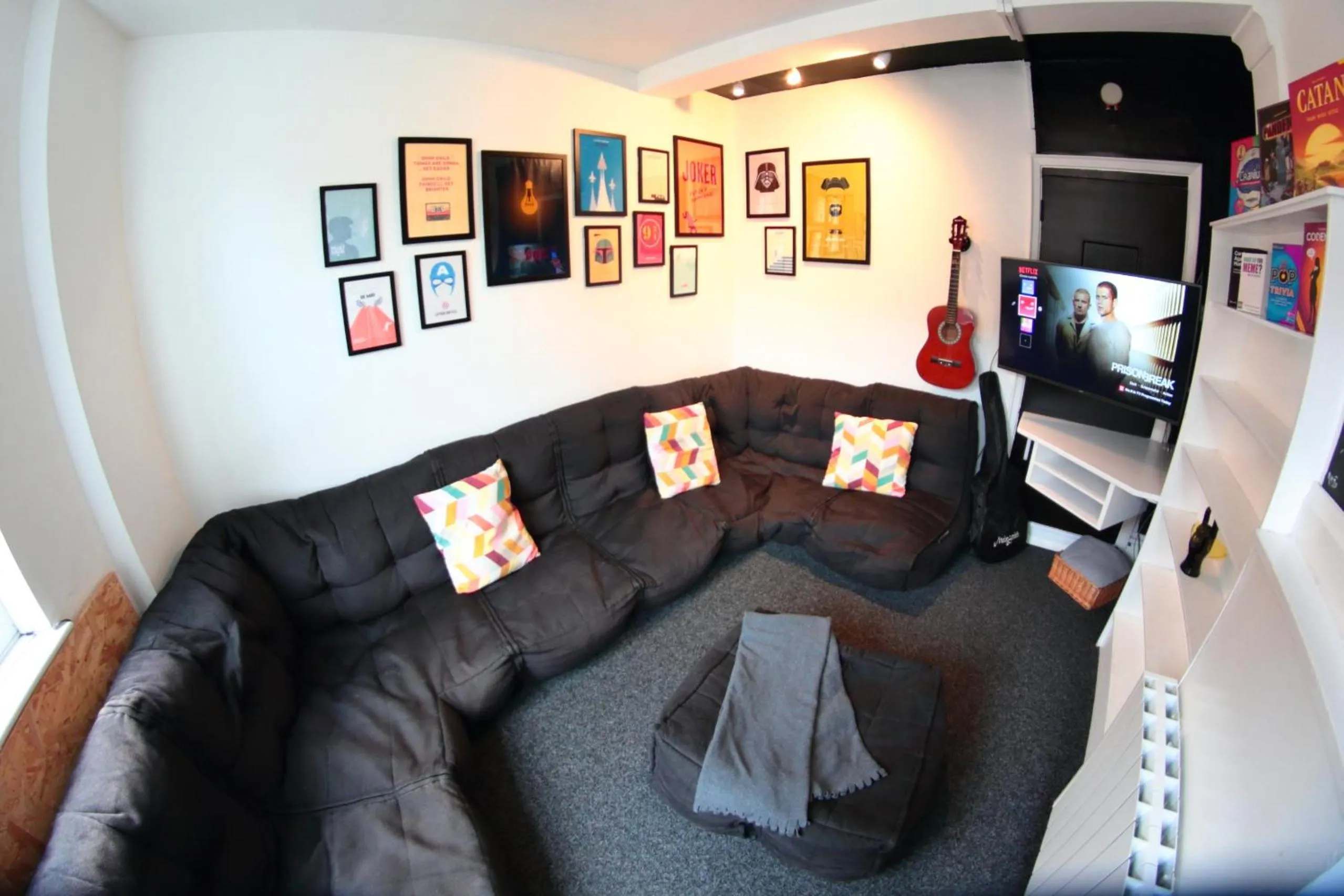 Communal lounge/ TV room in Central Backpackers