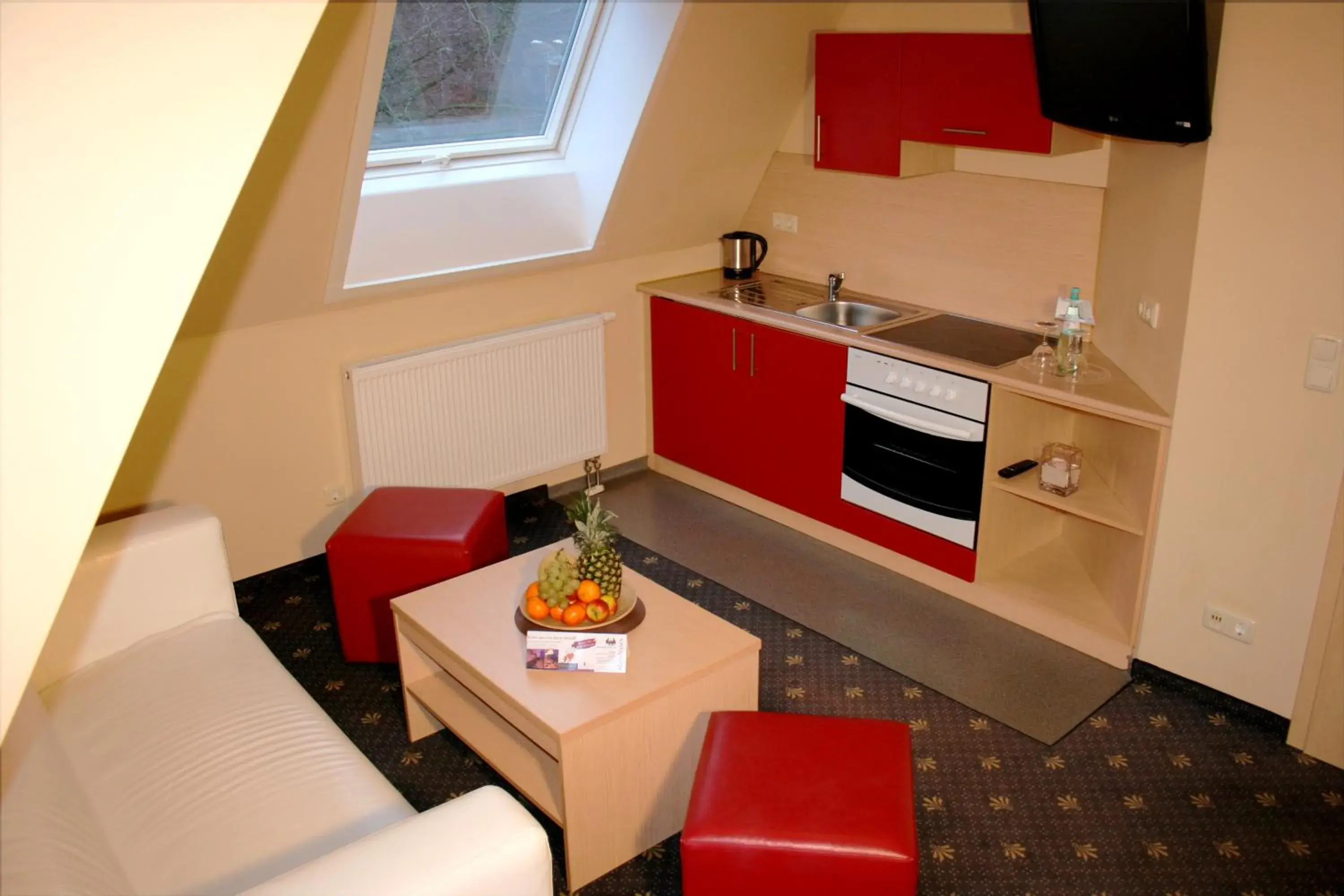 Photo of the whole room, Kitchen/Kitchenette in DAS HUDEWALD Hotel & Resort